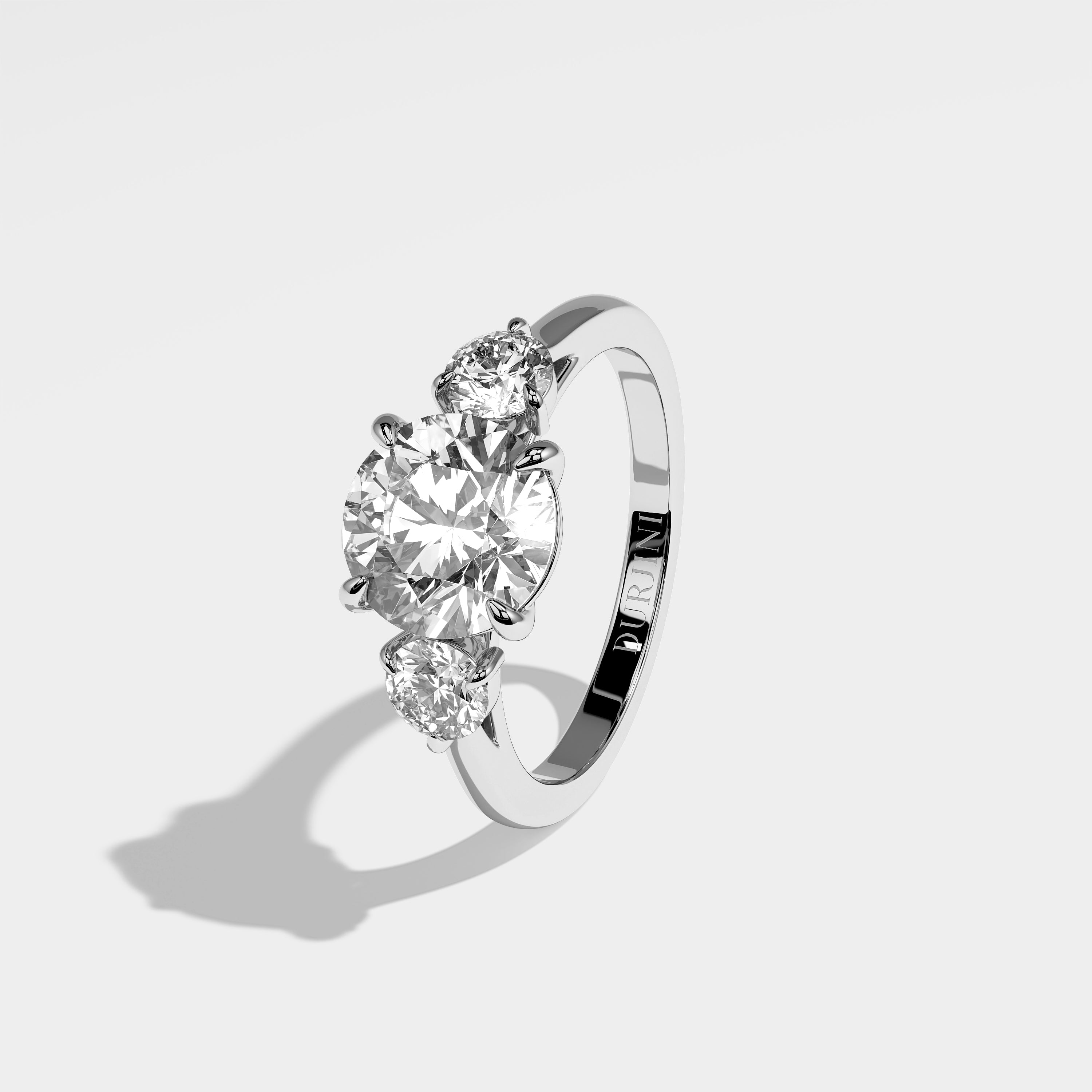 Olden round brilliant diamond engagement ring in 18K white gold by Kurbãni Durjini, left view