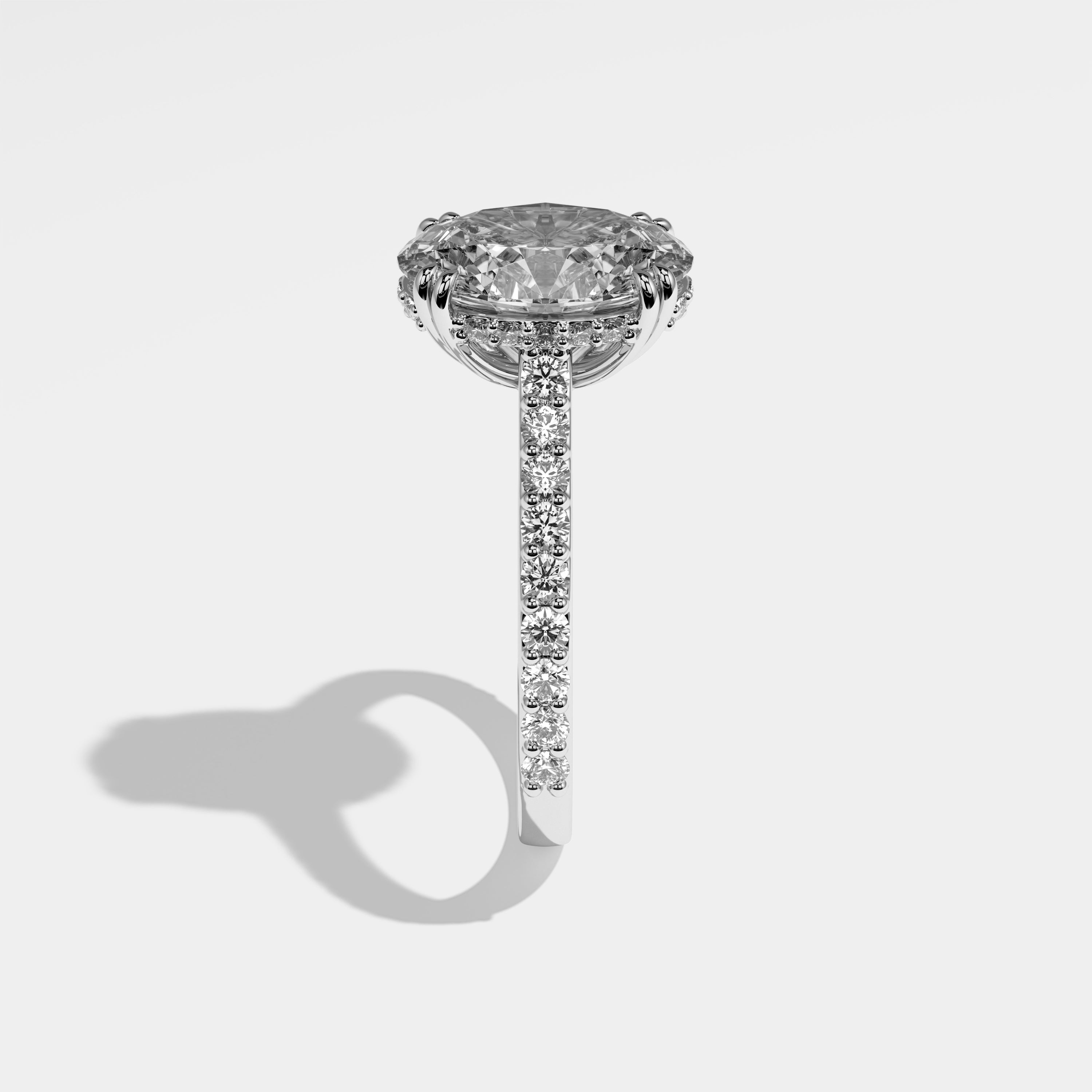 Eclipse oval halo diamond engagement ring in 18K white gold by Kurbãni Durjini, side view