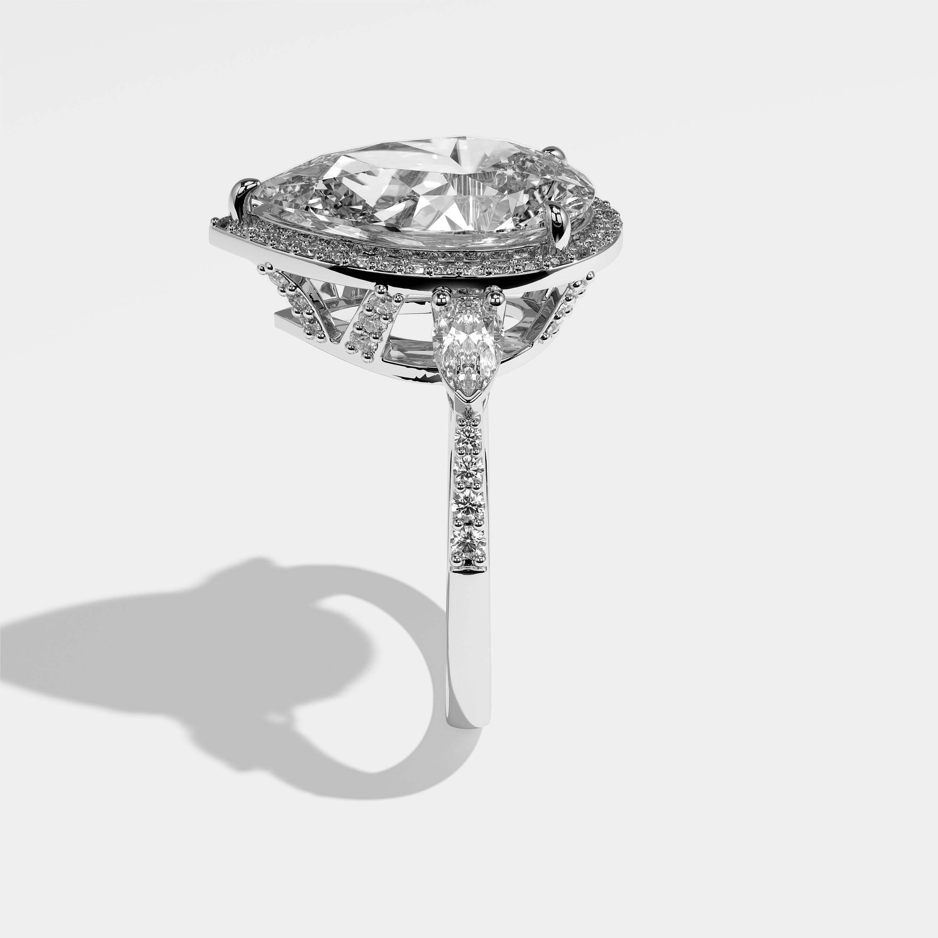 Michelle pear halo diamond engagement ring in 18K white gold by Kurbãni Durjini, side view