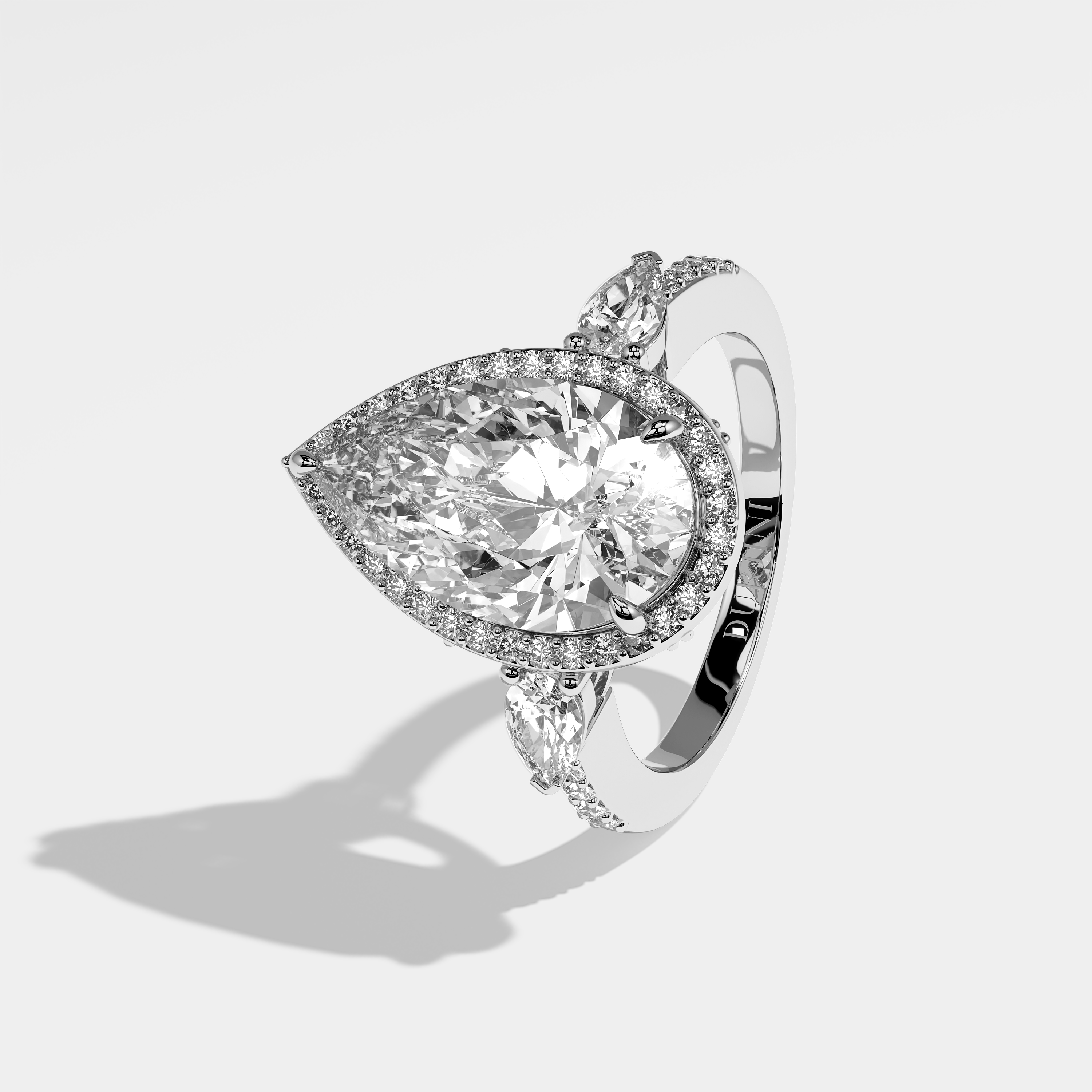 Michelle pear halo diamond engagement ring in 18K white gold by Kurbãni Durjini, left view