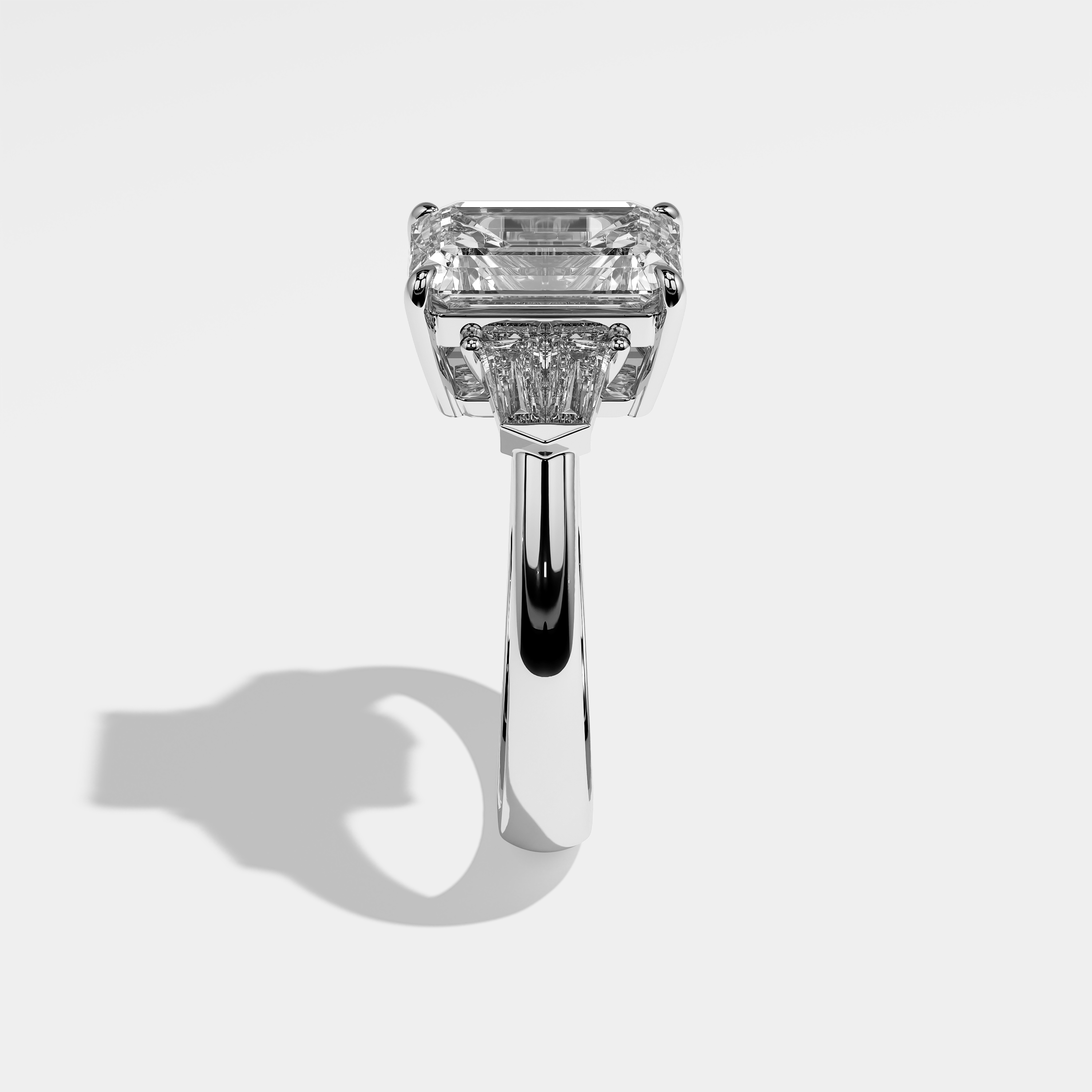 Ashley emerald diamond engagement ring in 18K white gold by Kurbãni Durjini, side view