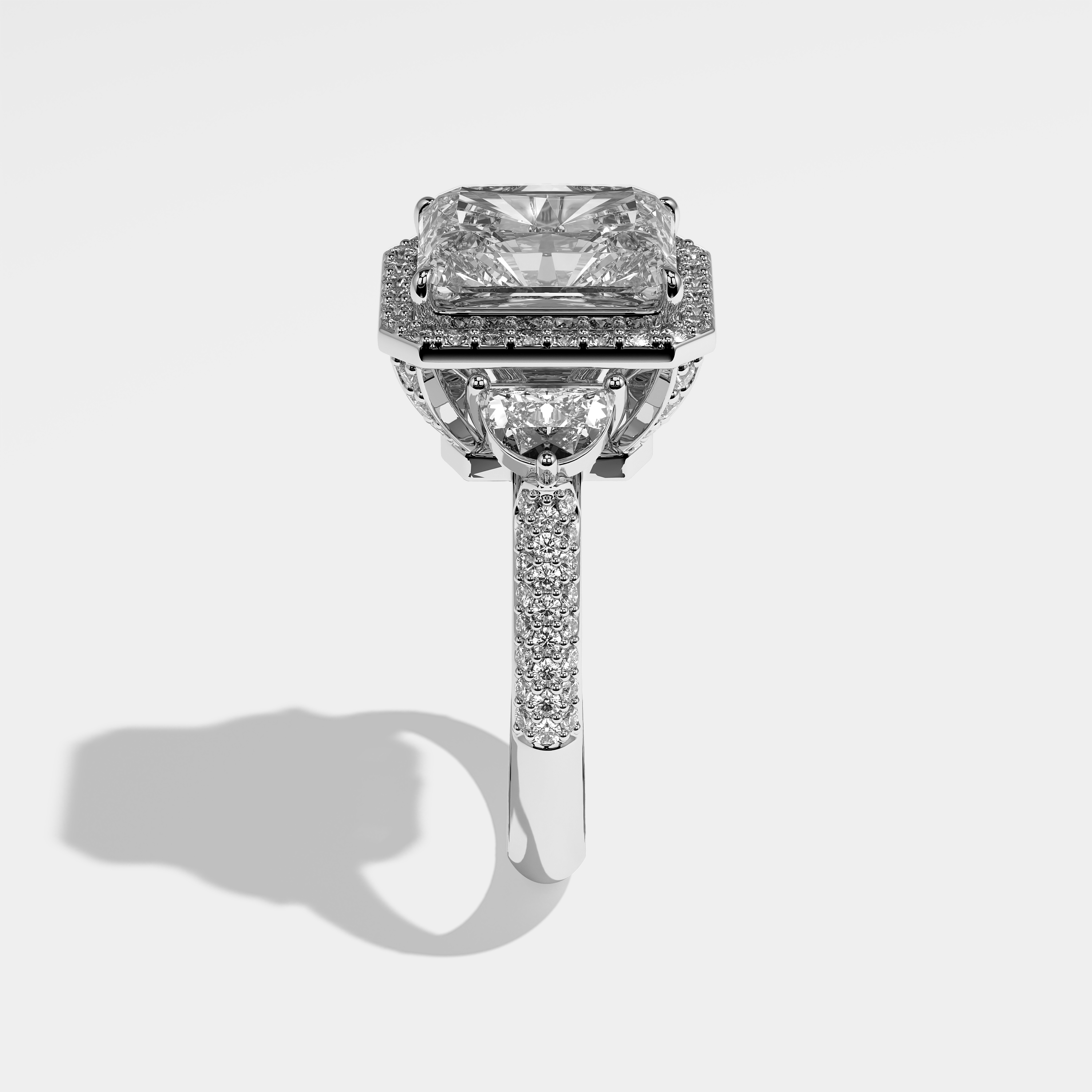 Meredith radiant halo diamond engagement ring in 18K white gold by Kurbãni Durjini, side view