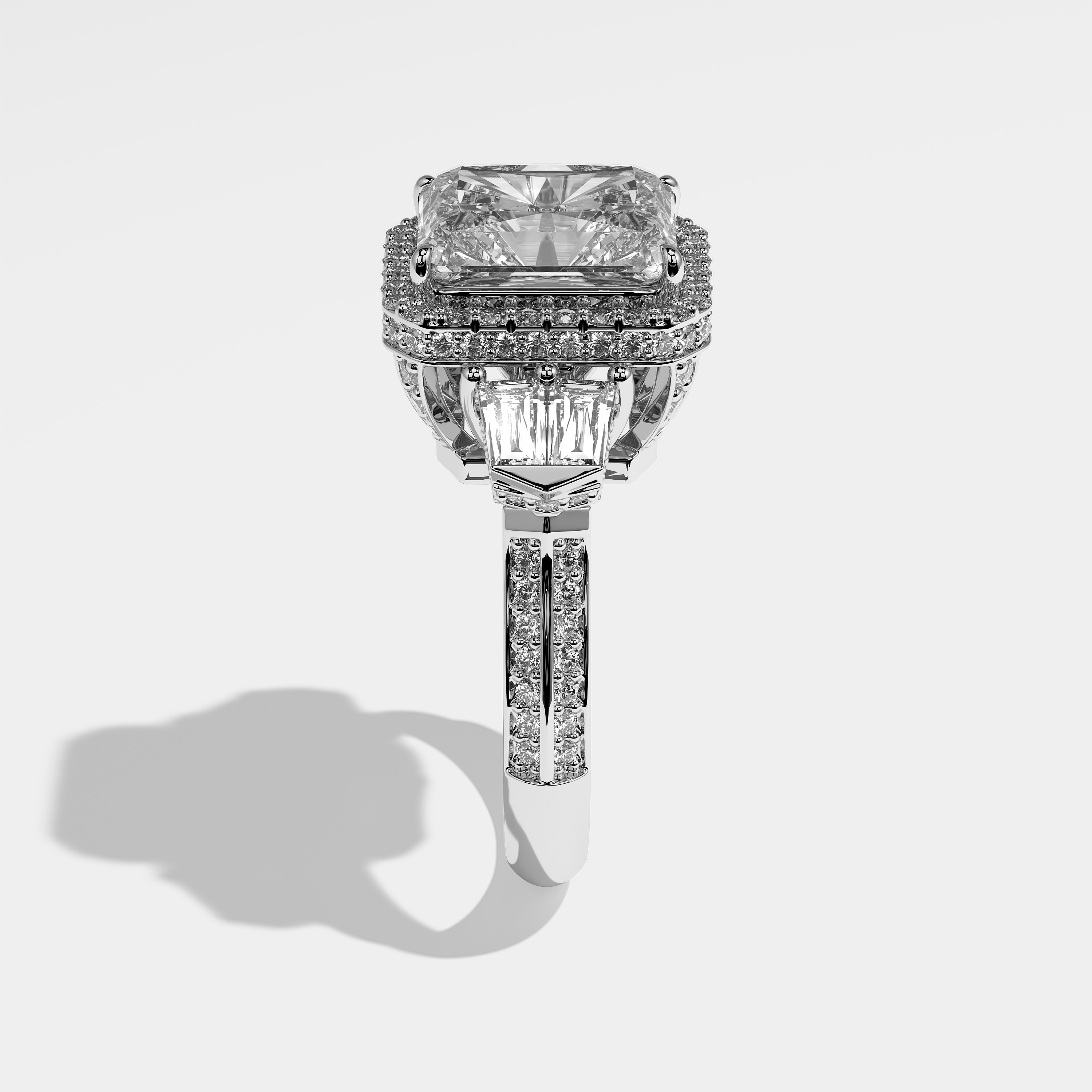 Claudia radiant halo diamond engagement ring in 18K white gold by Kurbãni Durjini, side view