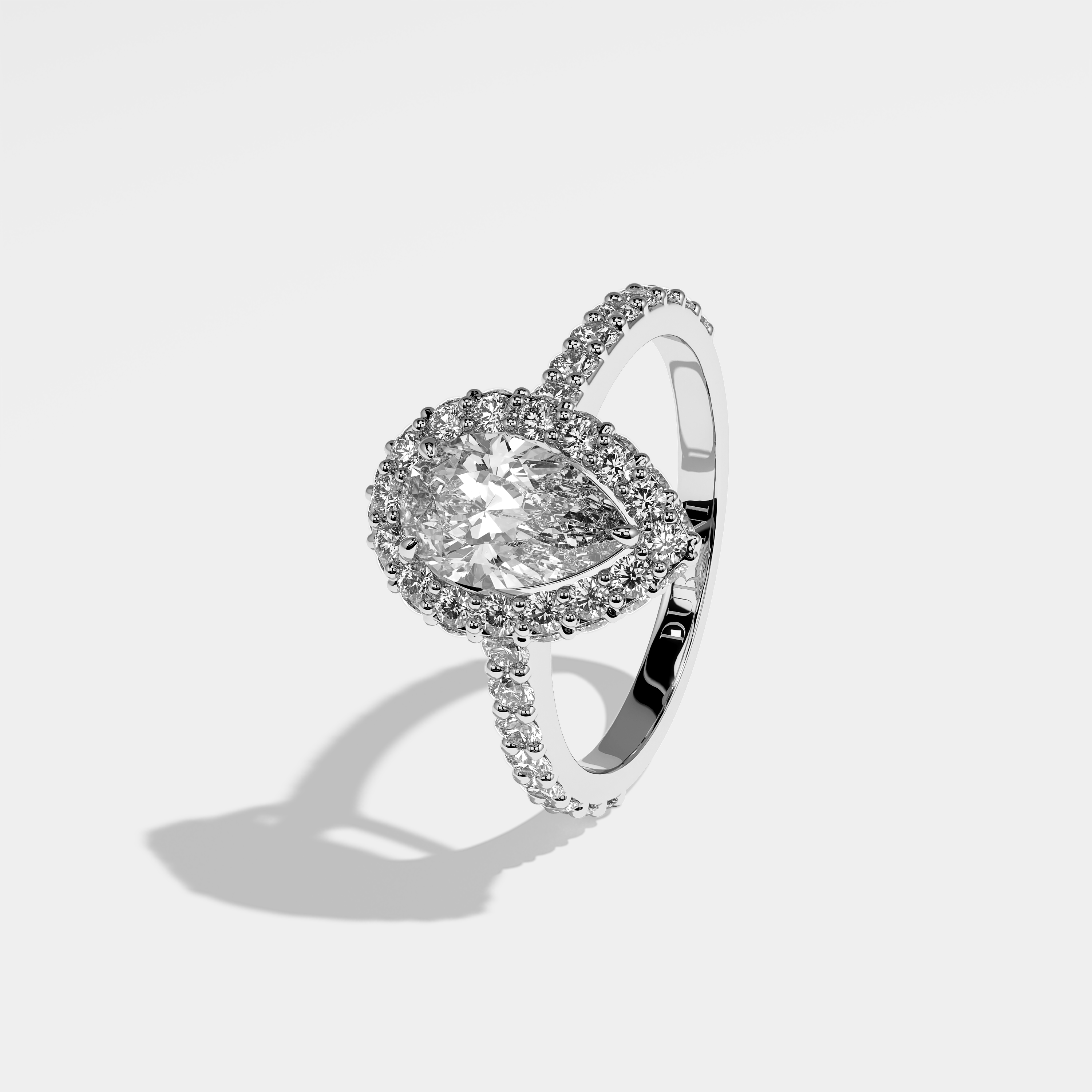 Lori pear halo diamond engagement ring in 18K white gold by Kurbãni Durjini, left view