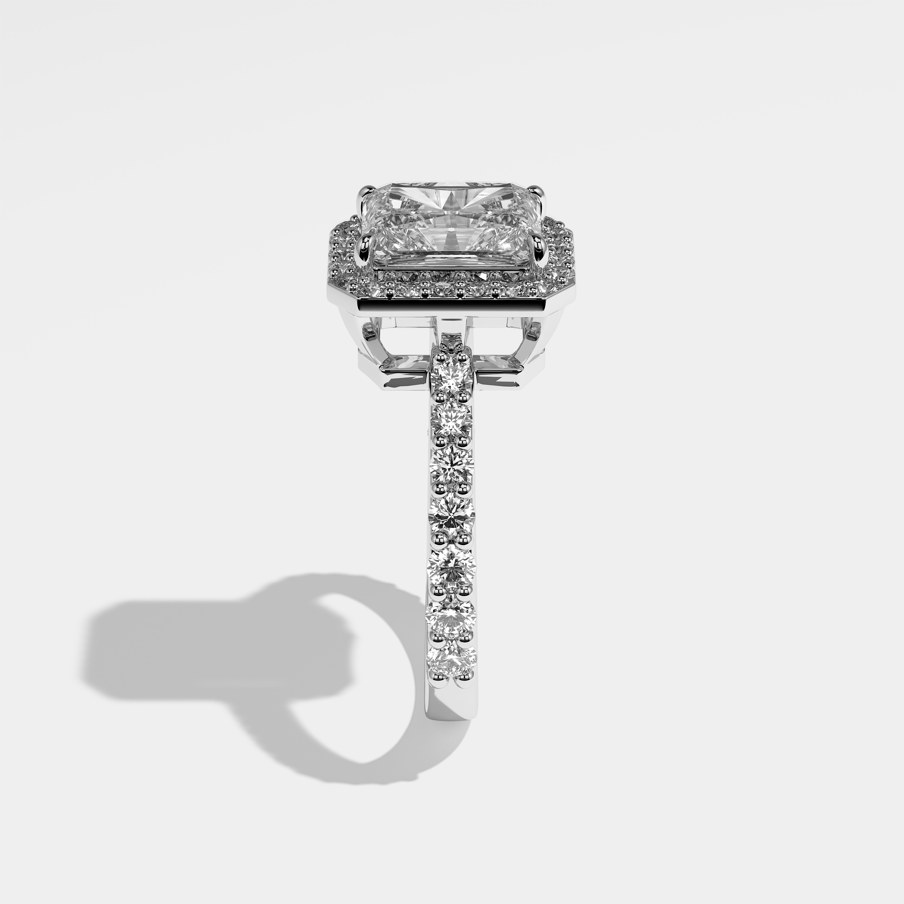 Nicola halo diamond engagement ring in 18K white gold by Kurbãni Durjini, side view