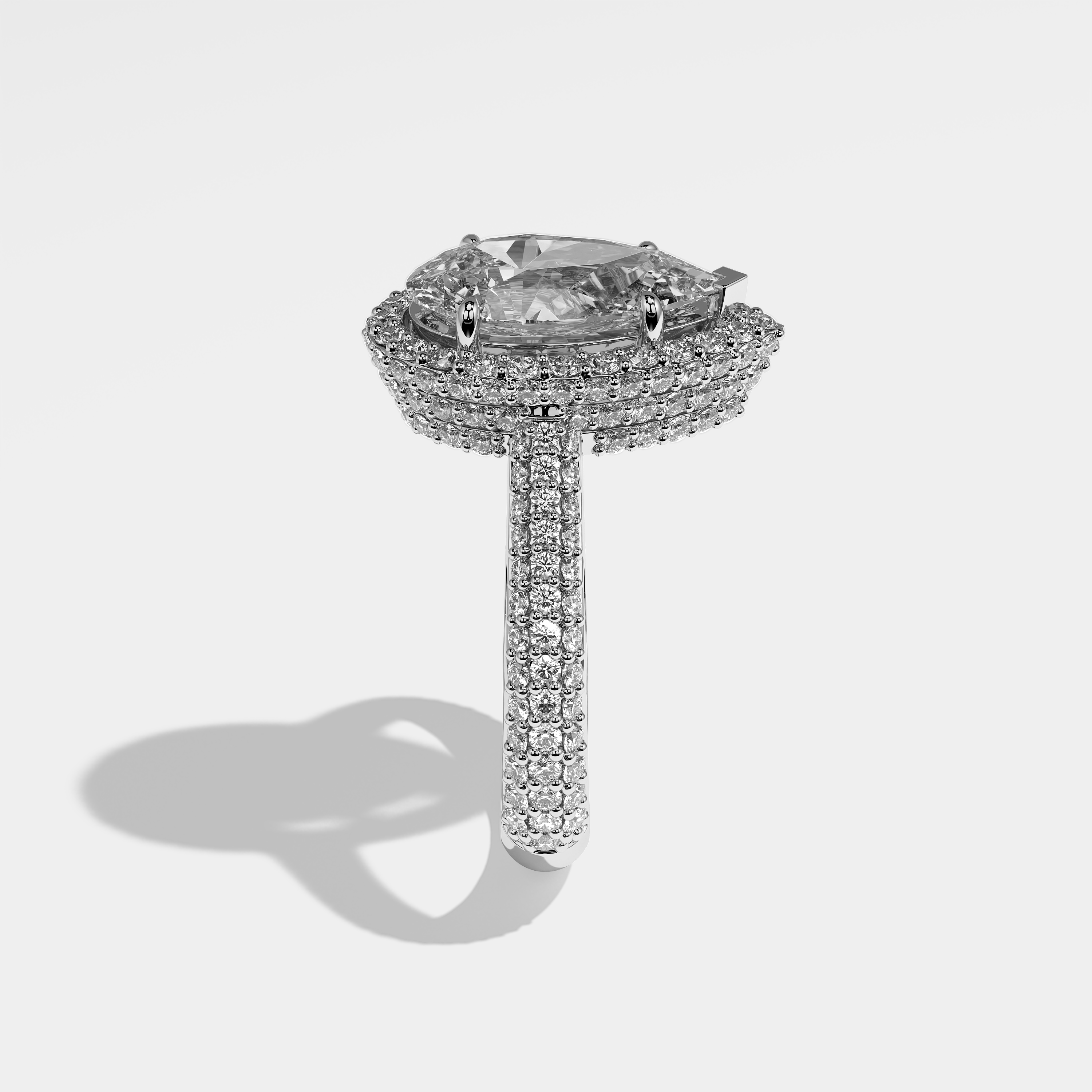 Tess pear halo diamond engagement ring in 18K white gold by Kurbãni Durjini, side view