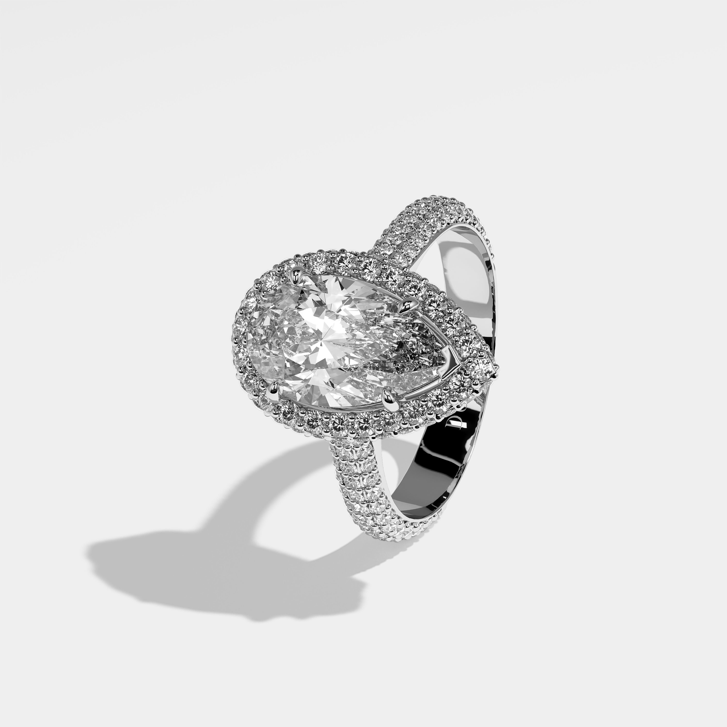 Tess pear halo diamond engagement ring in 18K white gold by Kurbãni Durjini, left view
