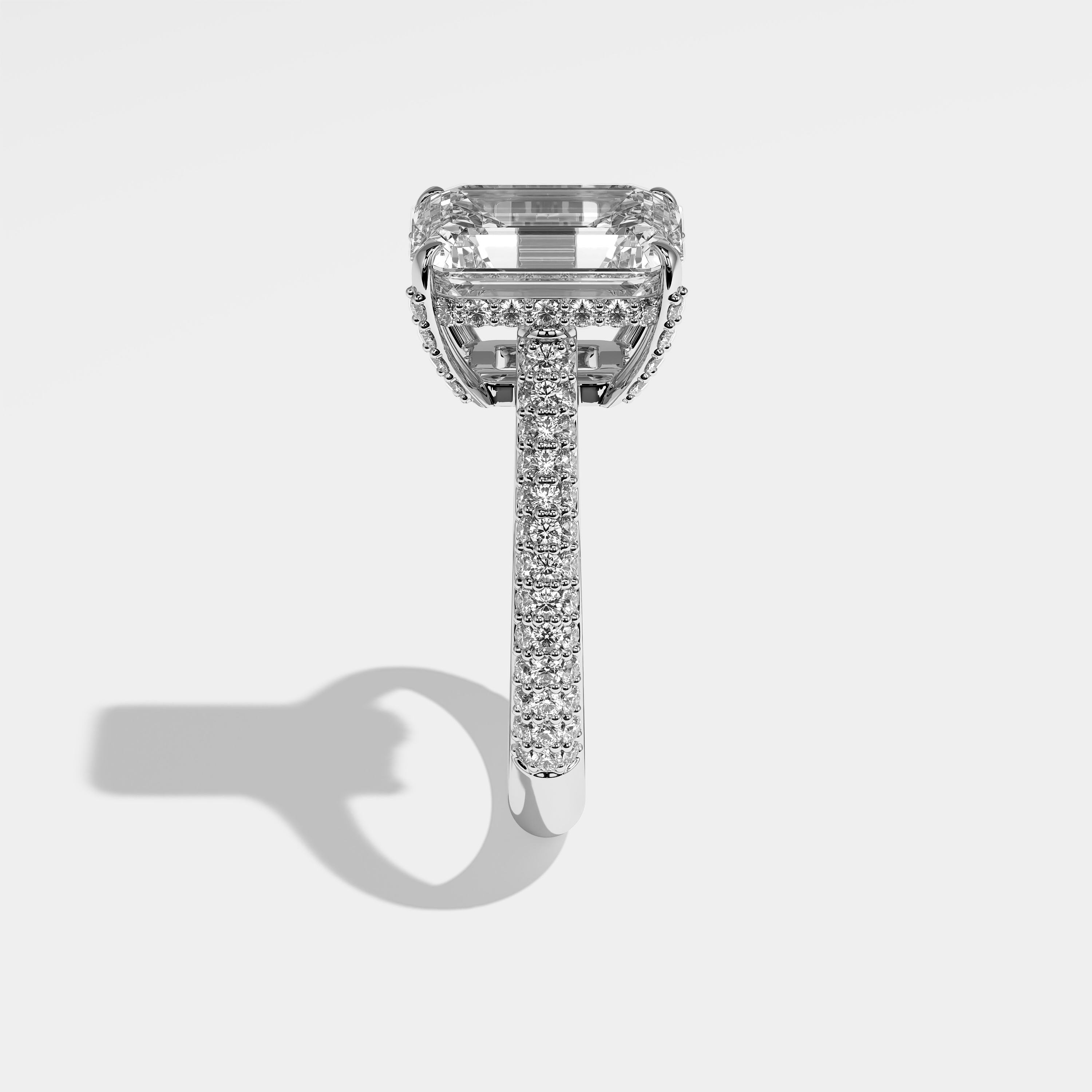 Jess emerald halo diamond engagement ring in 18K white gold by Kurbãni Durjini, side view