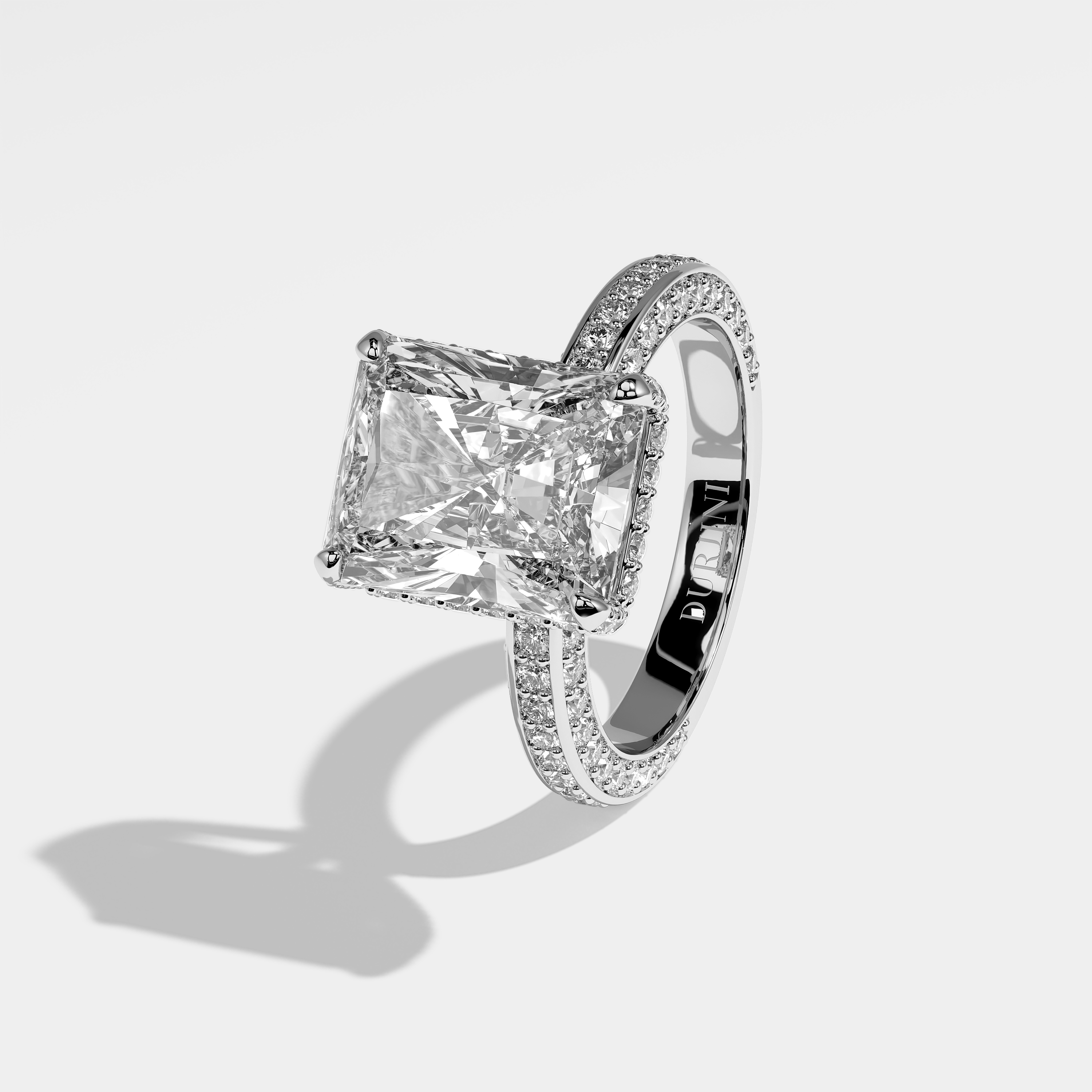Philippa radiant halo diamond engagement ring in 18K white gold by Kurbãni Durjini, left view