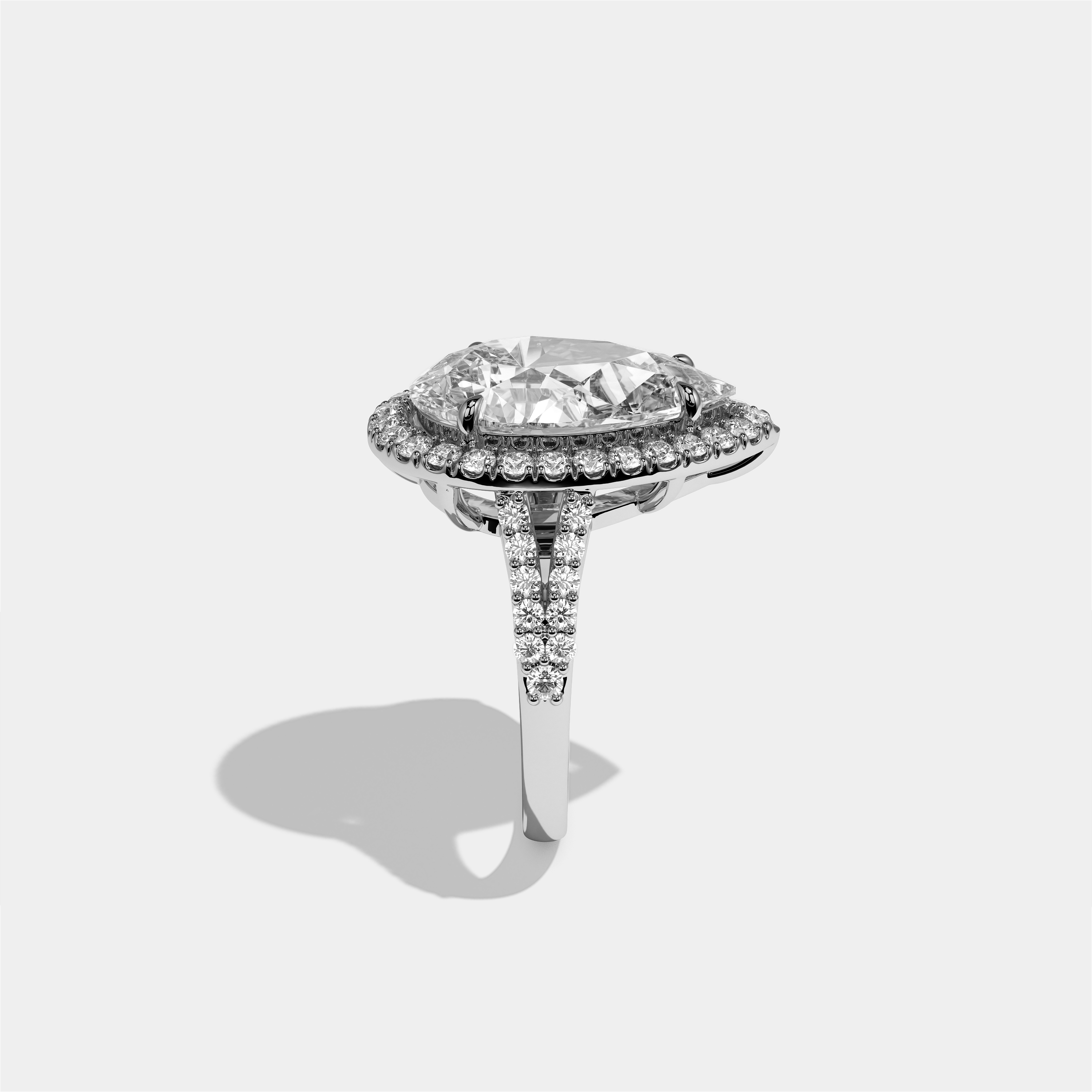 Helena diamond pear halo engagement ring in 18K white gold by Kurbãni Durjini, side view