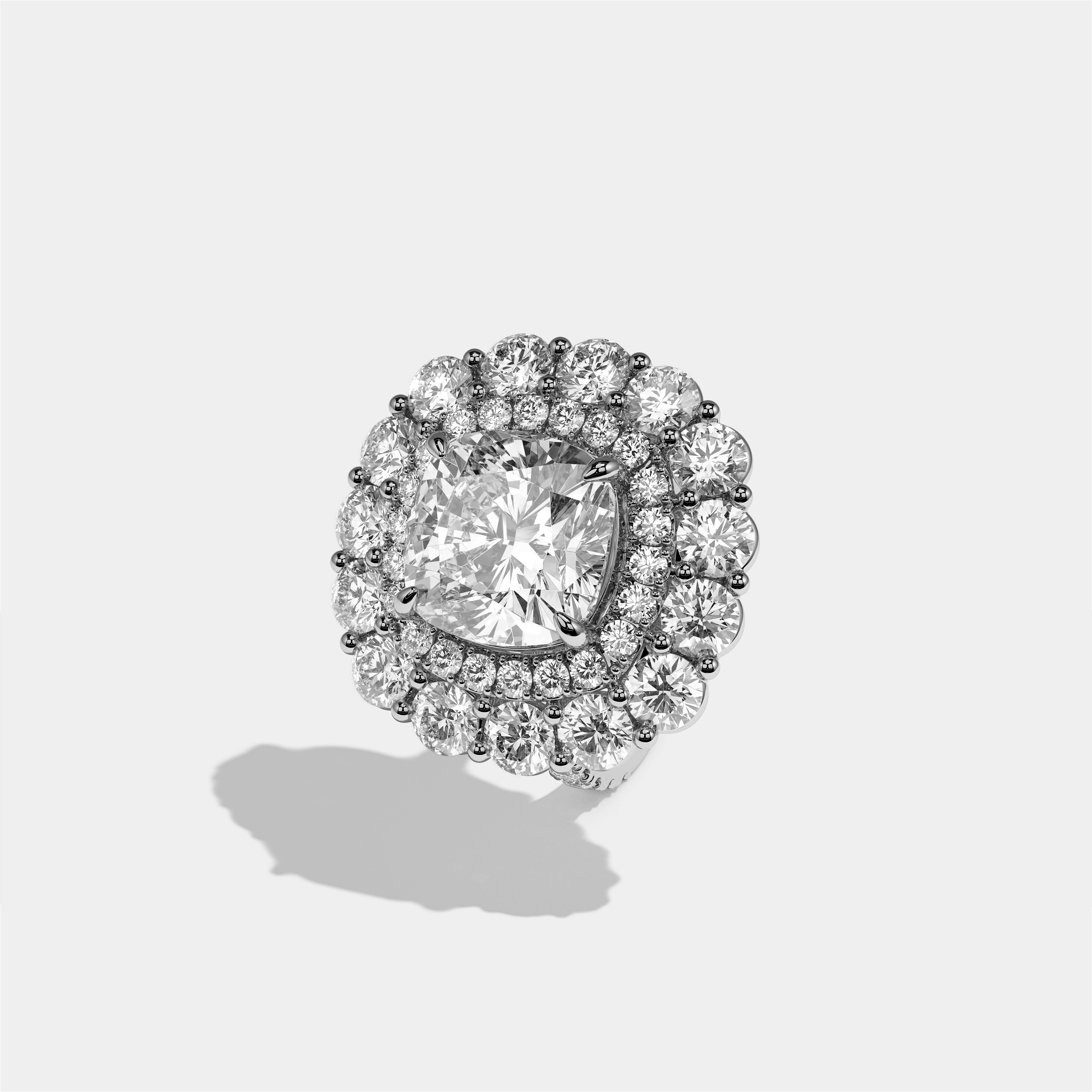 Pauline Étoile diamond cushion halo engagement ring in 18K white gold by Kurbãni Durjini, left view