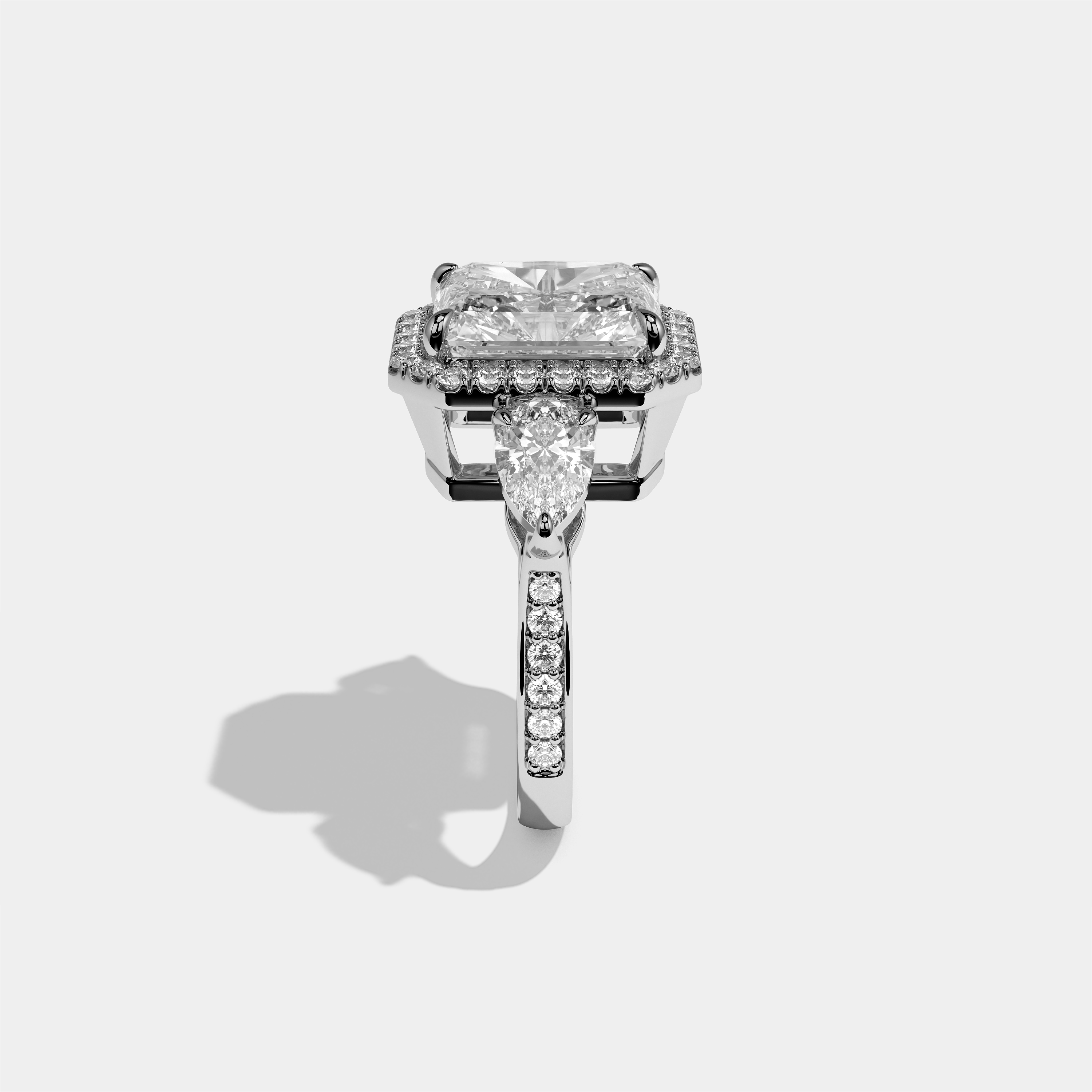 Marian Letitia diamond radiant halo engagement ring in 18K white gold by Kurbãni Durjini, side view