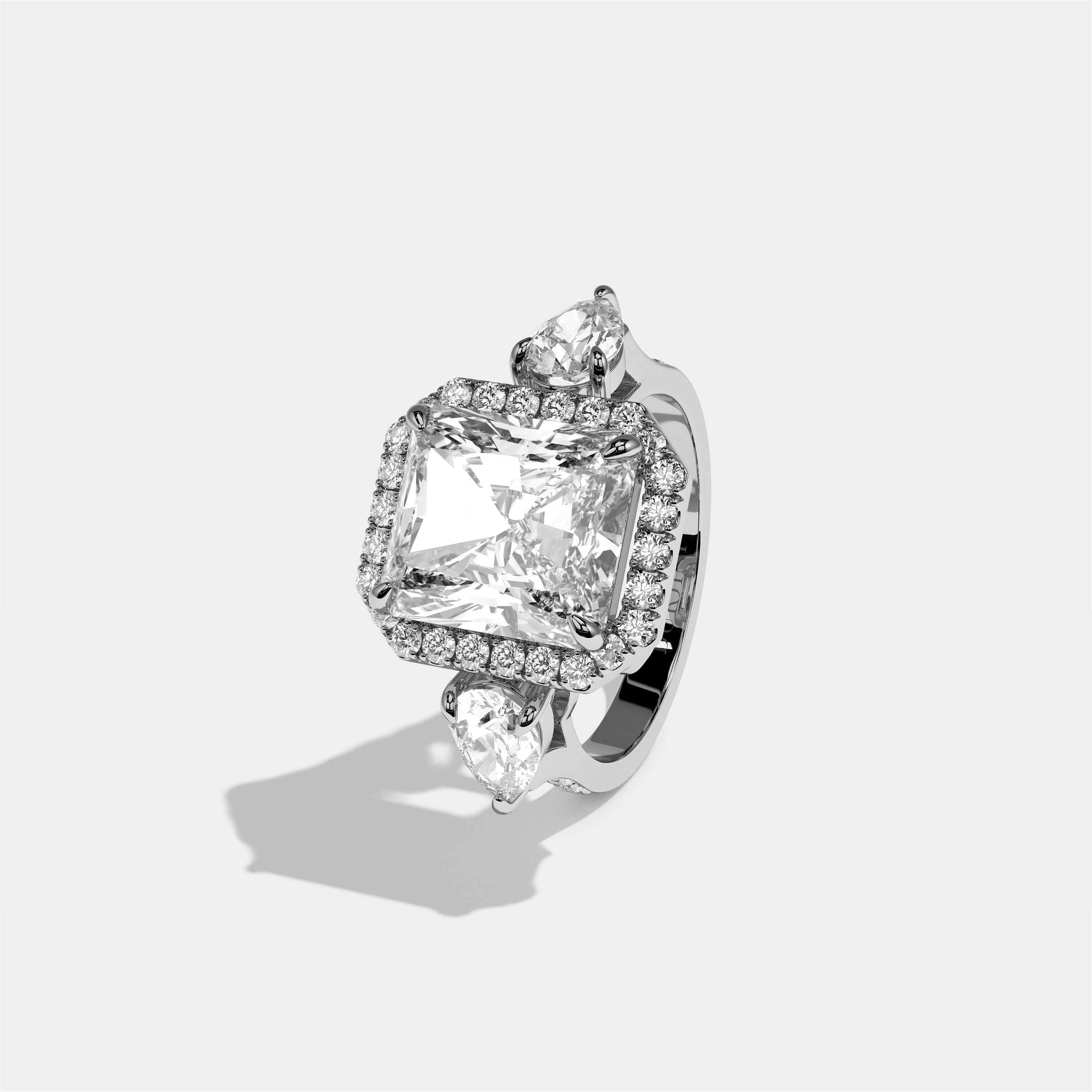 Marian Letitia diamond radiant halo engagement ring in 18K white gold by Kurbãni Durjini, left view