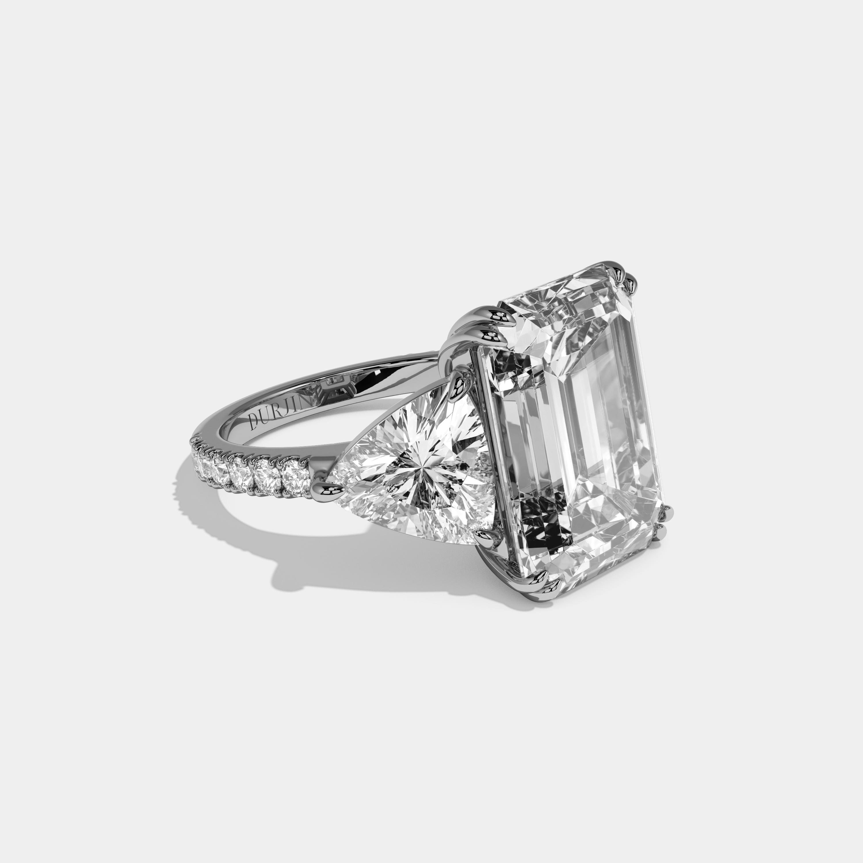 Vionnet Emerald Cut Diamond Halo Engagement Ring With Twin Trillion Cut Sides 10ct 18k White Gold