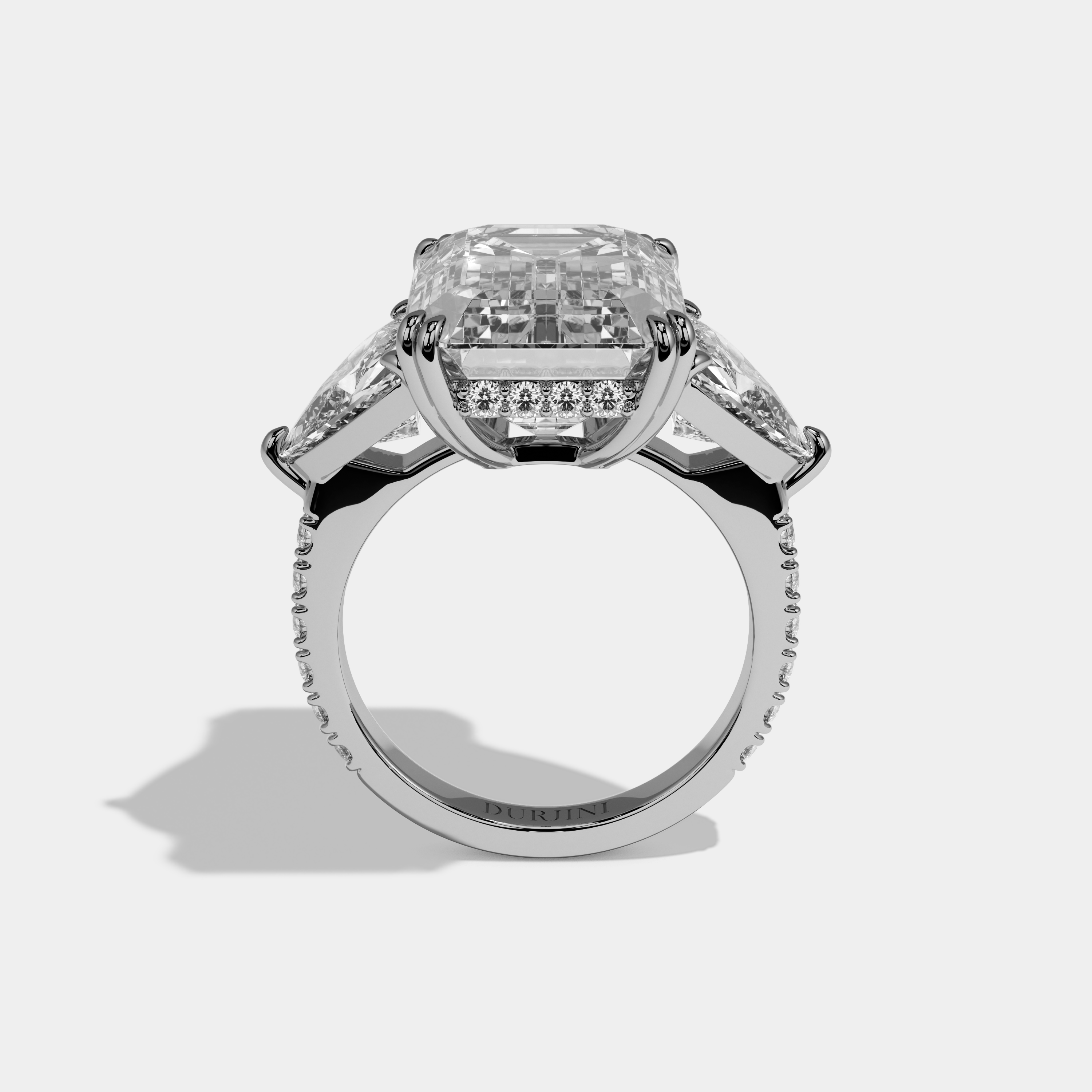 Vionnet Emerald Cut Diamond Halo Engagement Ring With Twin Trillion Cut Sides 10ct 18k White Gold