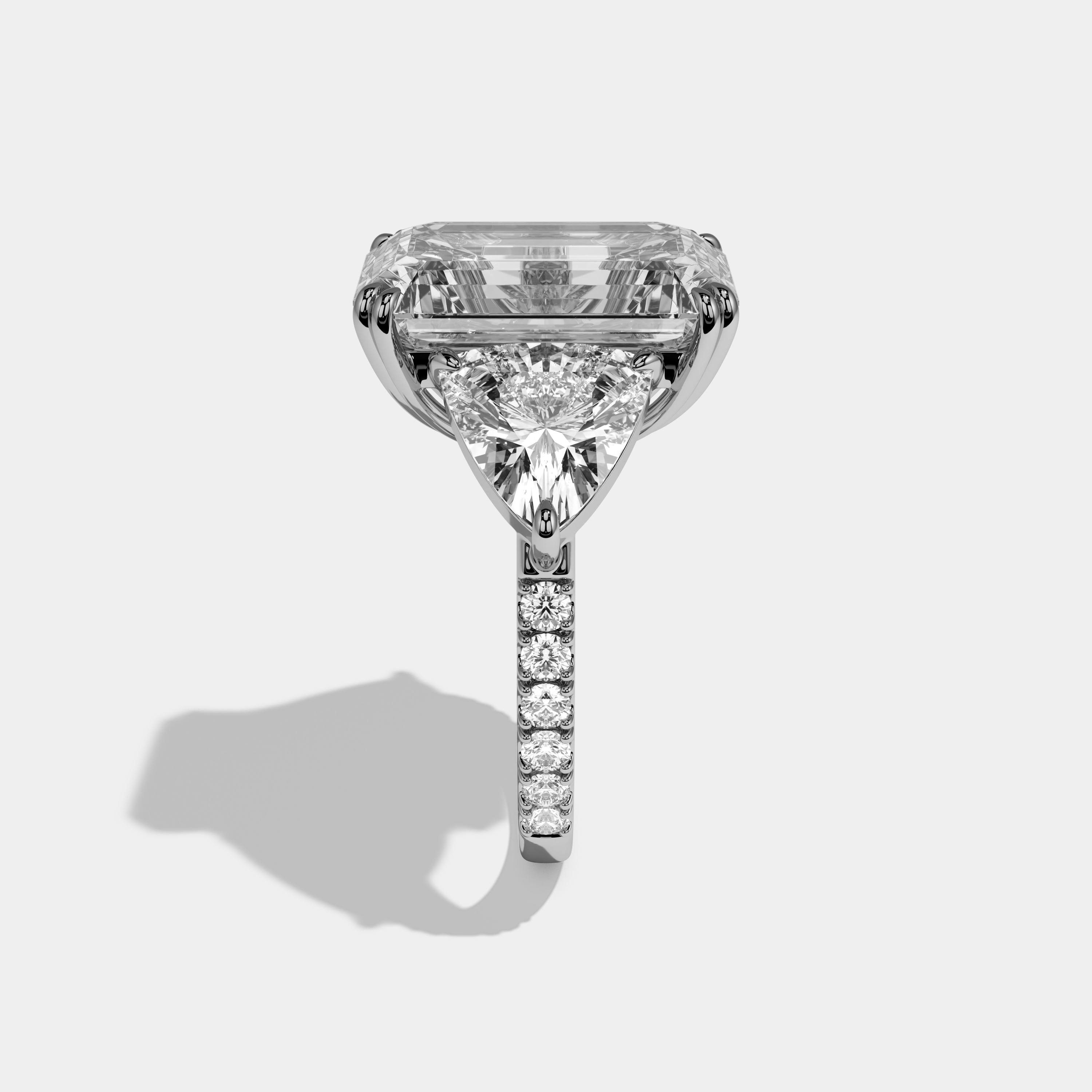 Vionnet Emerald Cut Diamond Halo Engagement Ring With Twin Trillion Cut Sides 10ct 18k White Gold