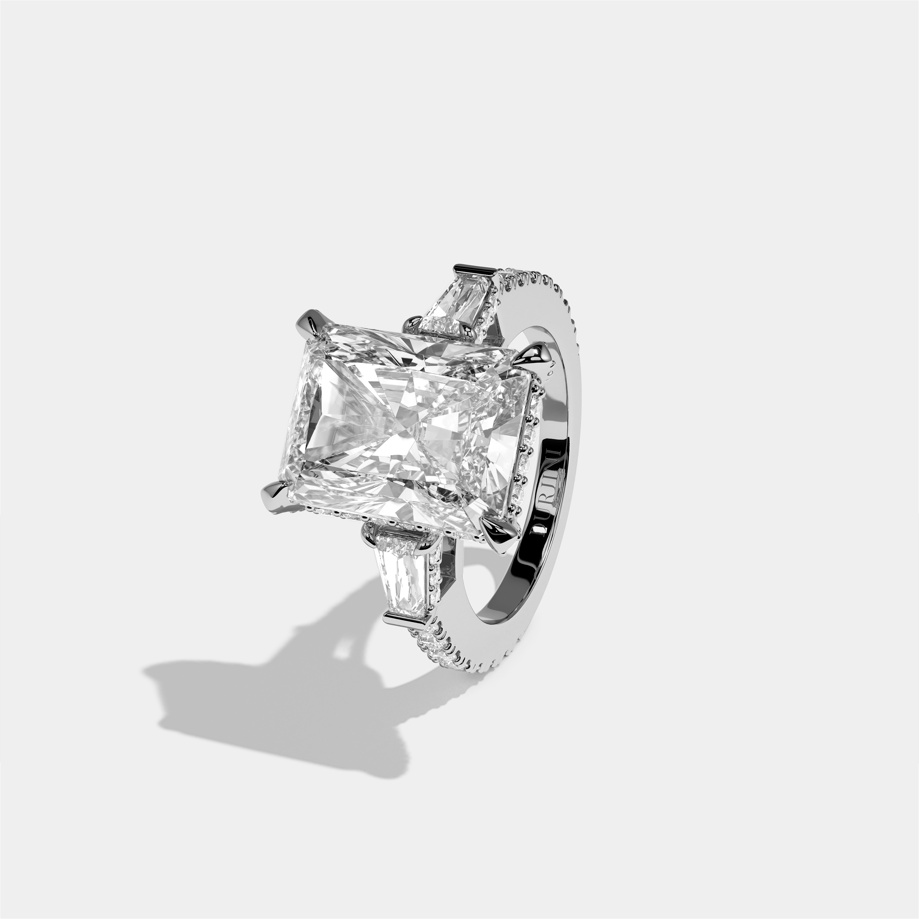 Esther Eclat diamond radiant halo engagement ring in 18K white gold by Kurbãni Durjini, left view