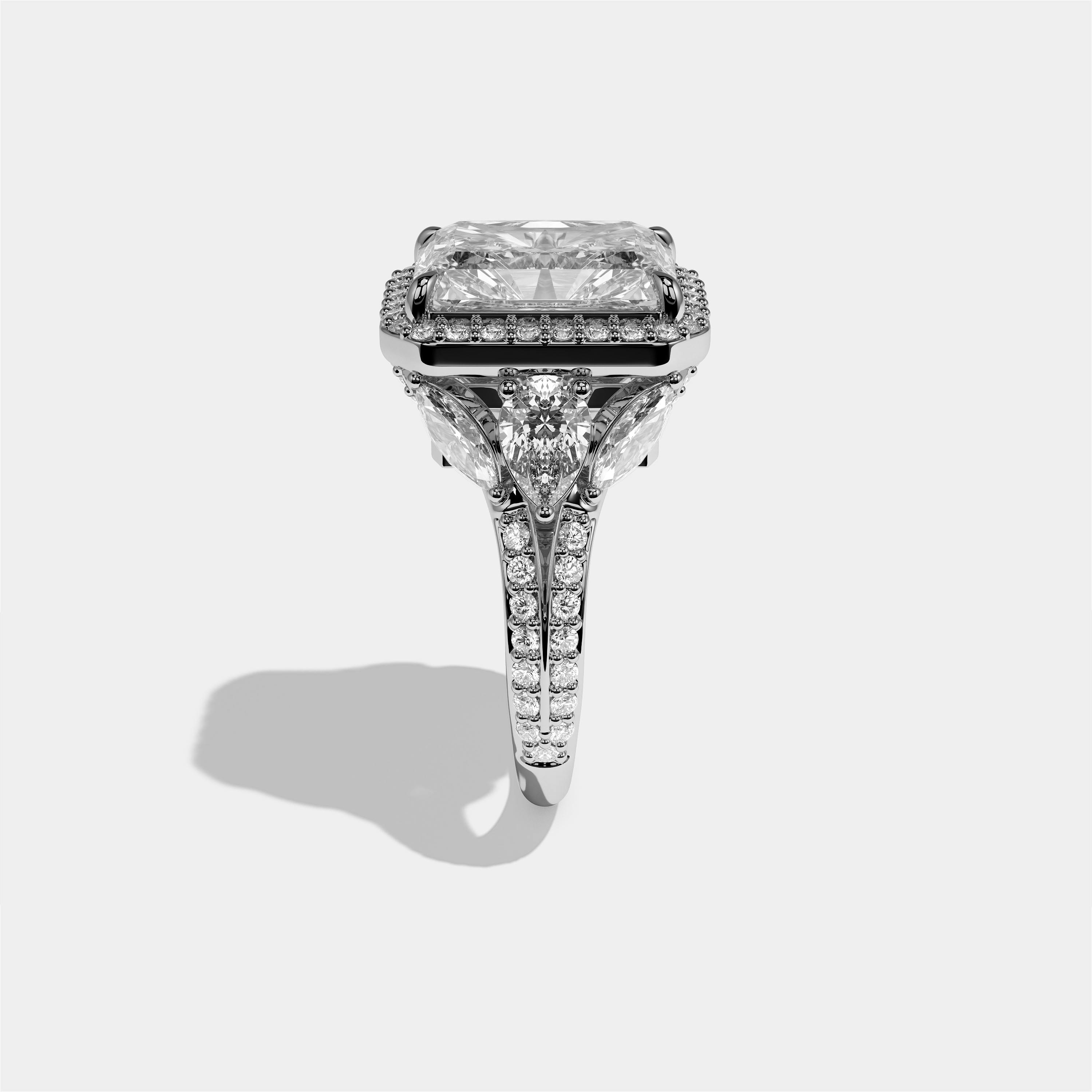 Rina Eclat diamond radiant halo engagement ring in 18K white gold by Kurbãni Durjini, side view