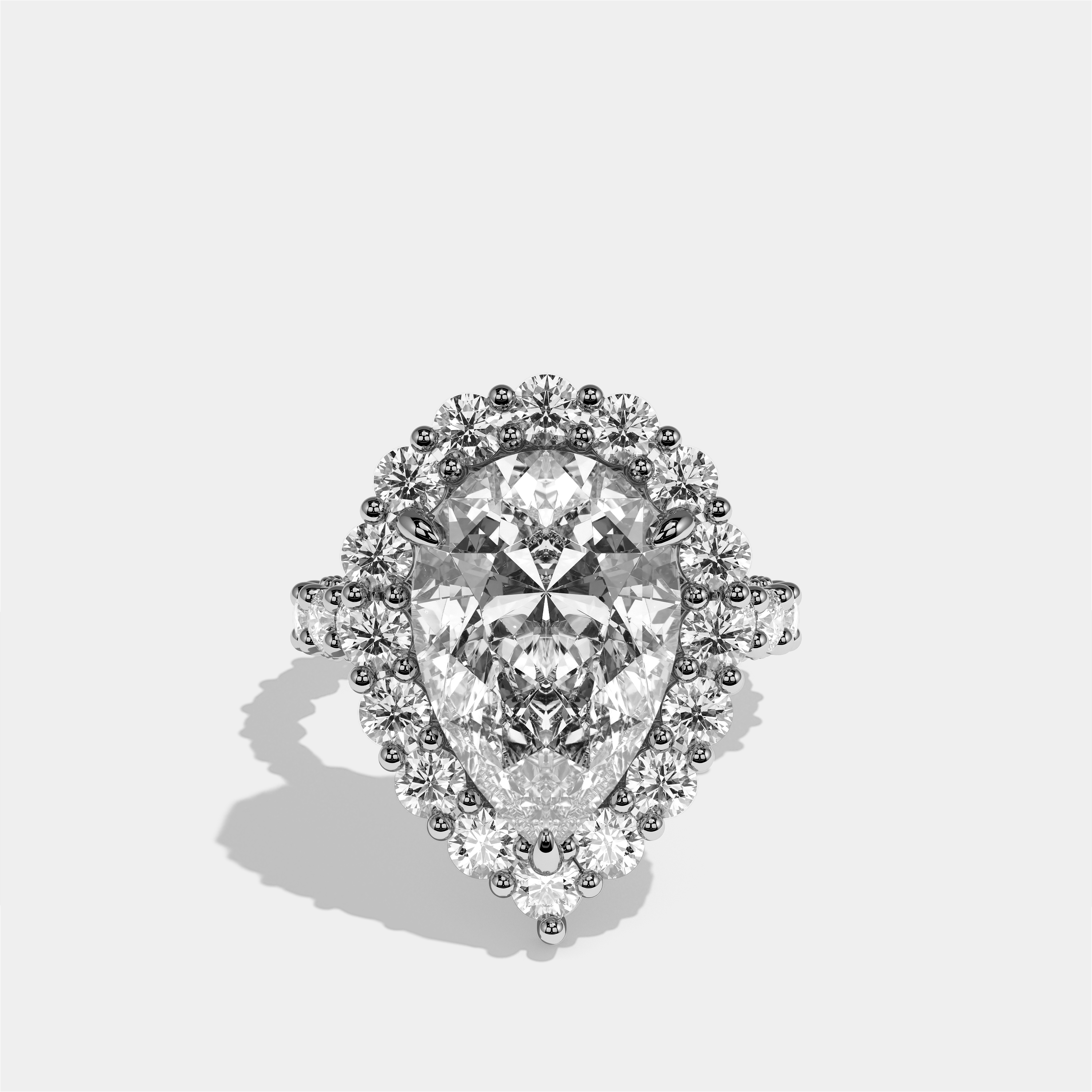 Judith diamond pear halo engagement ring in 18K white gold by Kurbãni Durjini, front view