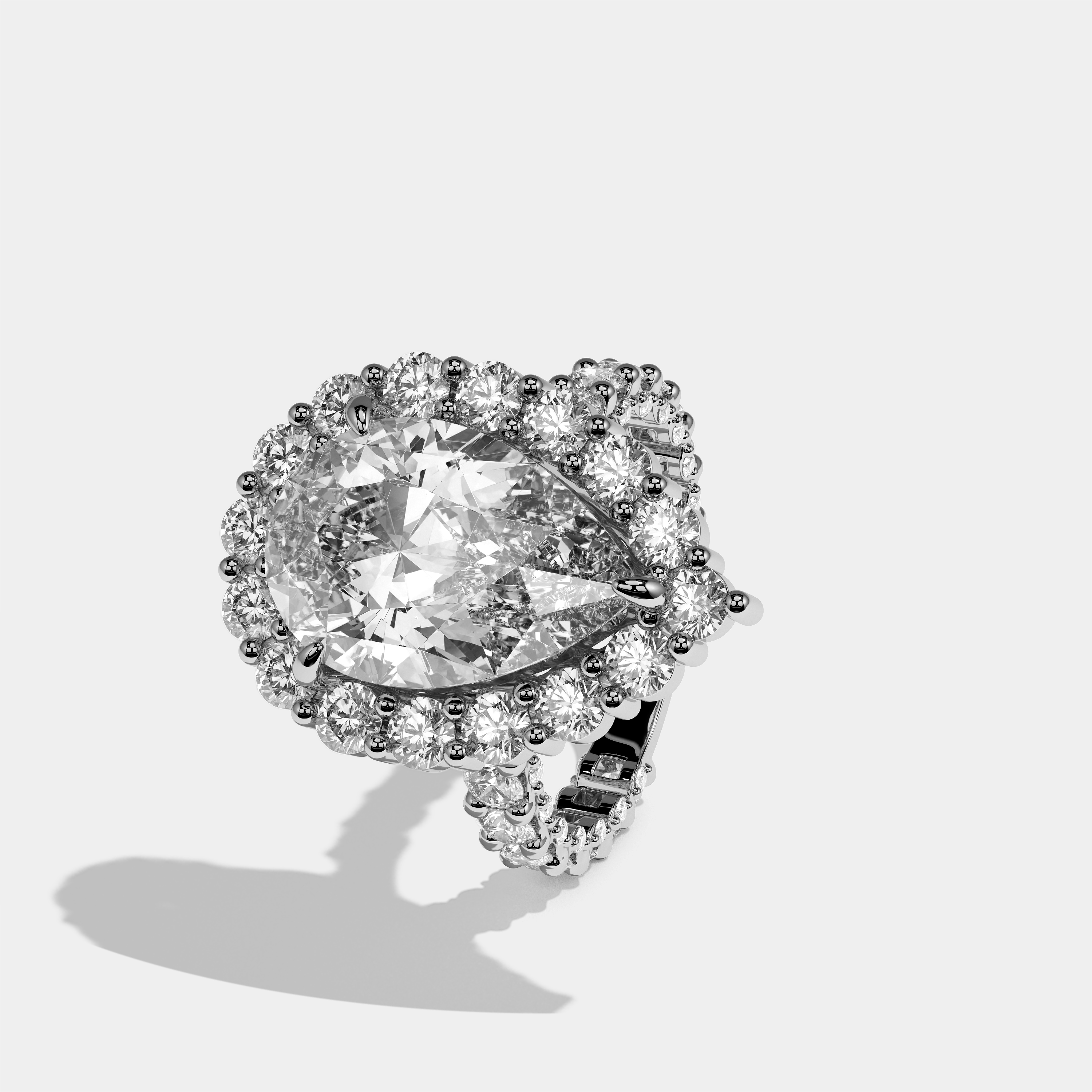 Judith diamond pear halo engagement ring in 18K white gold by Kurbãni Durjini, left view