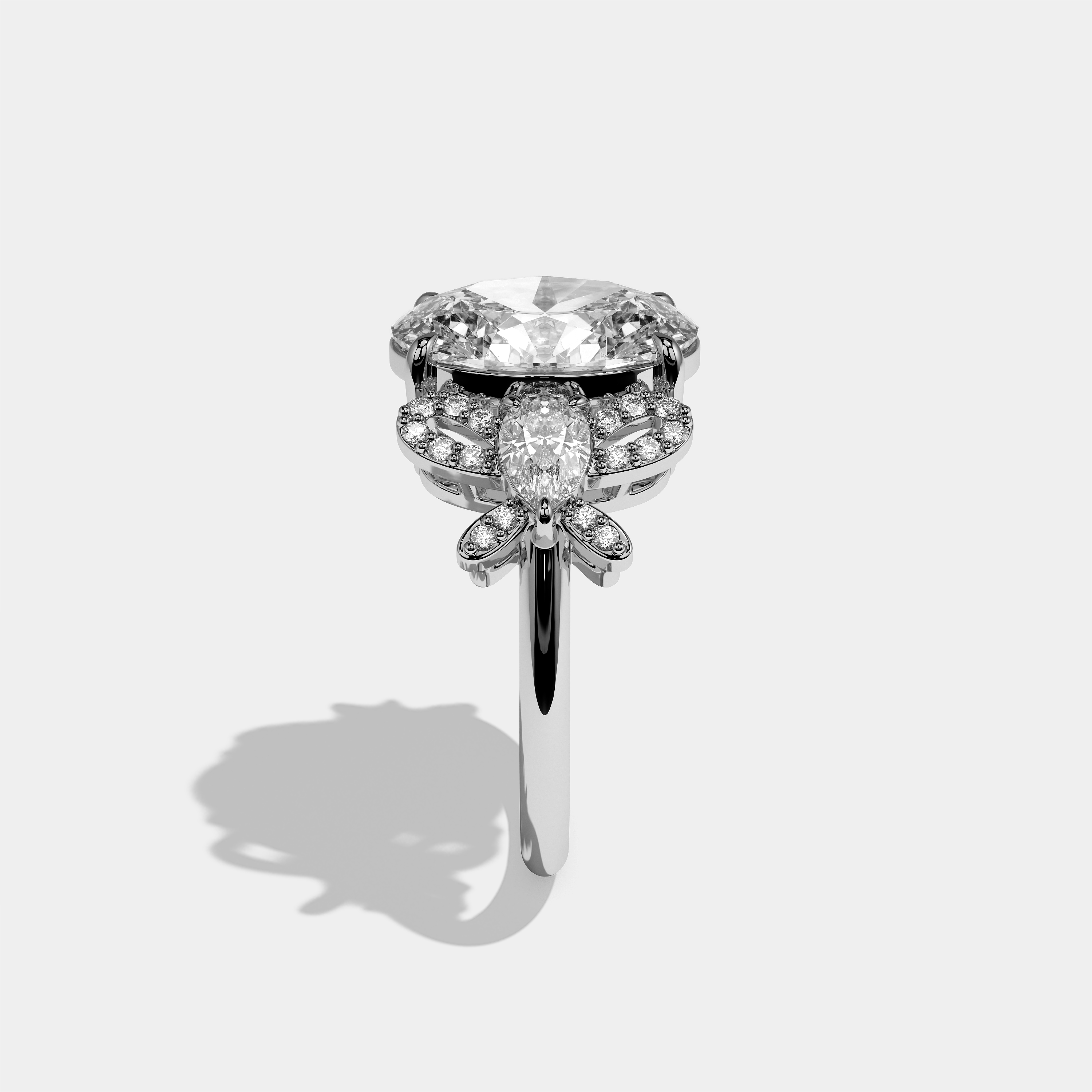 Malkah diamond oval halo engagement ring in 18K white gold by Kurbãni Durjini, side view