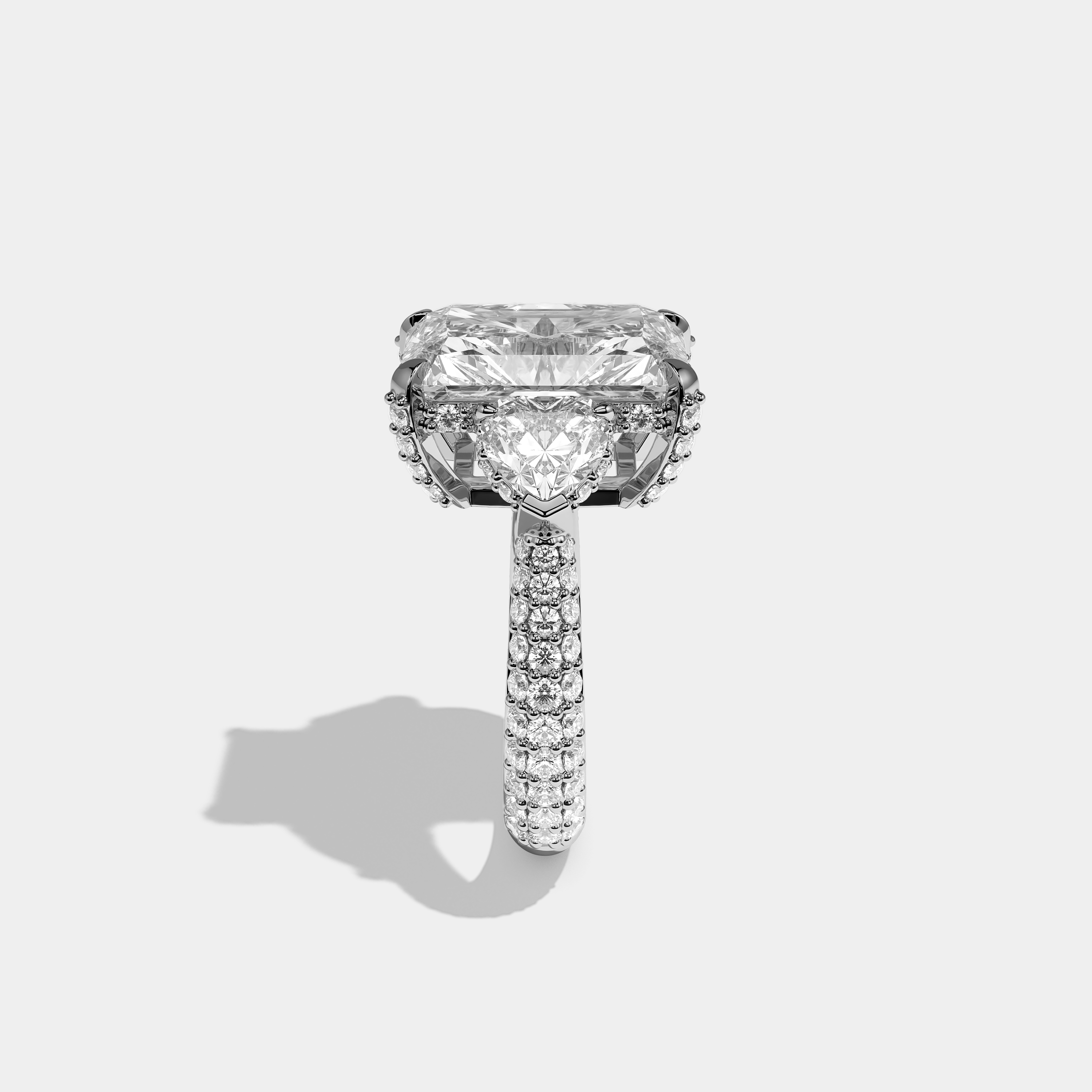 Mira 12.00ct diamond radiant halo engagement ring in 18K white gold by Kurbãni Durjini, side view