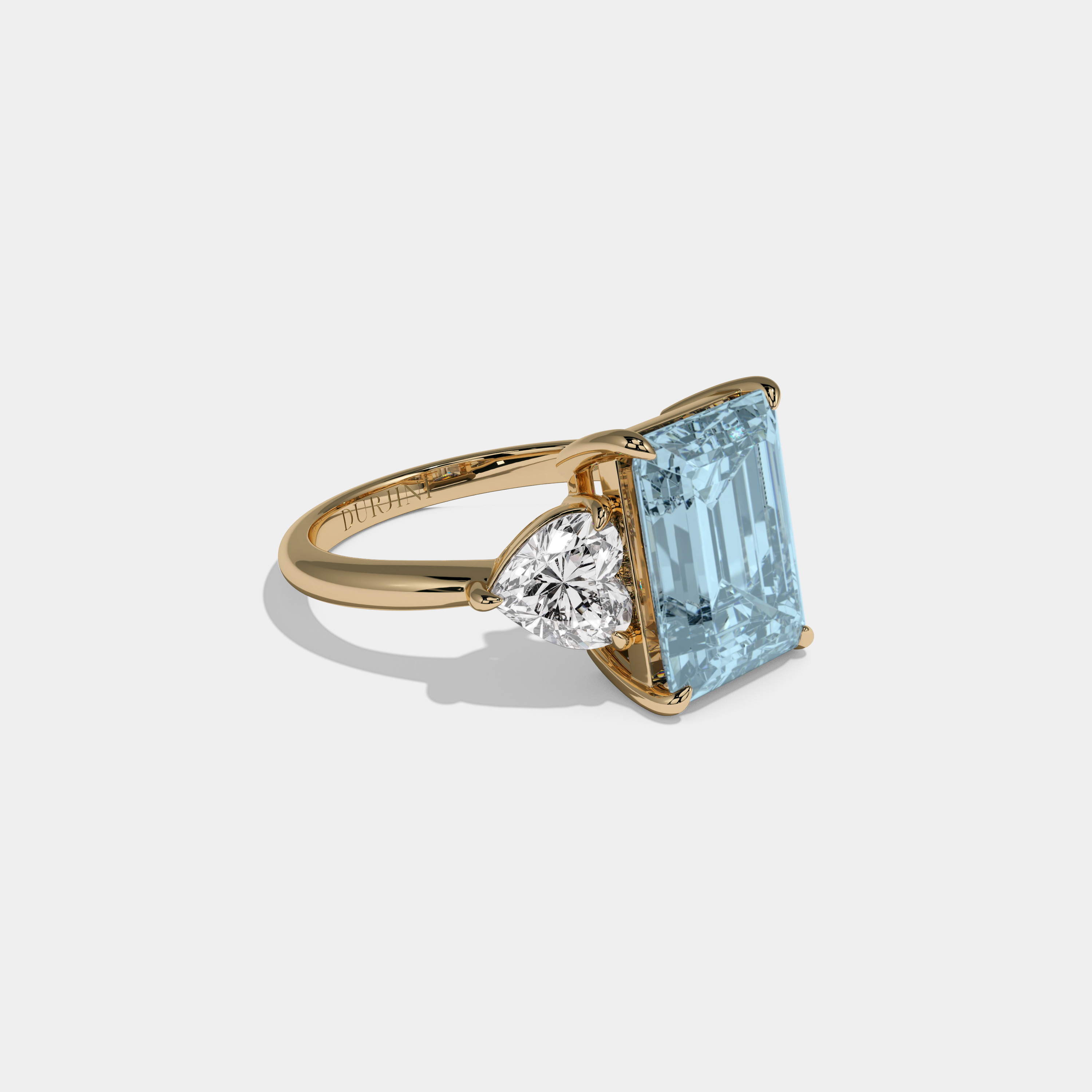 Caroline Fancy Light Blue Emerald Cut Diamond Plain Band With Heart Cut Sides Engagement Ring 8ct 18K Yellow Gold