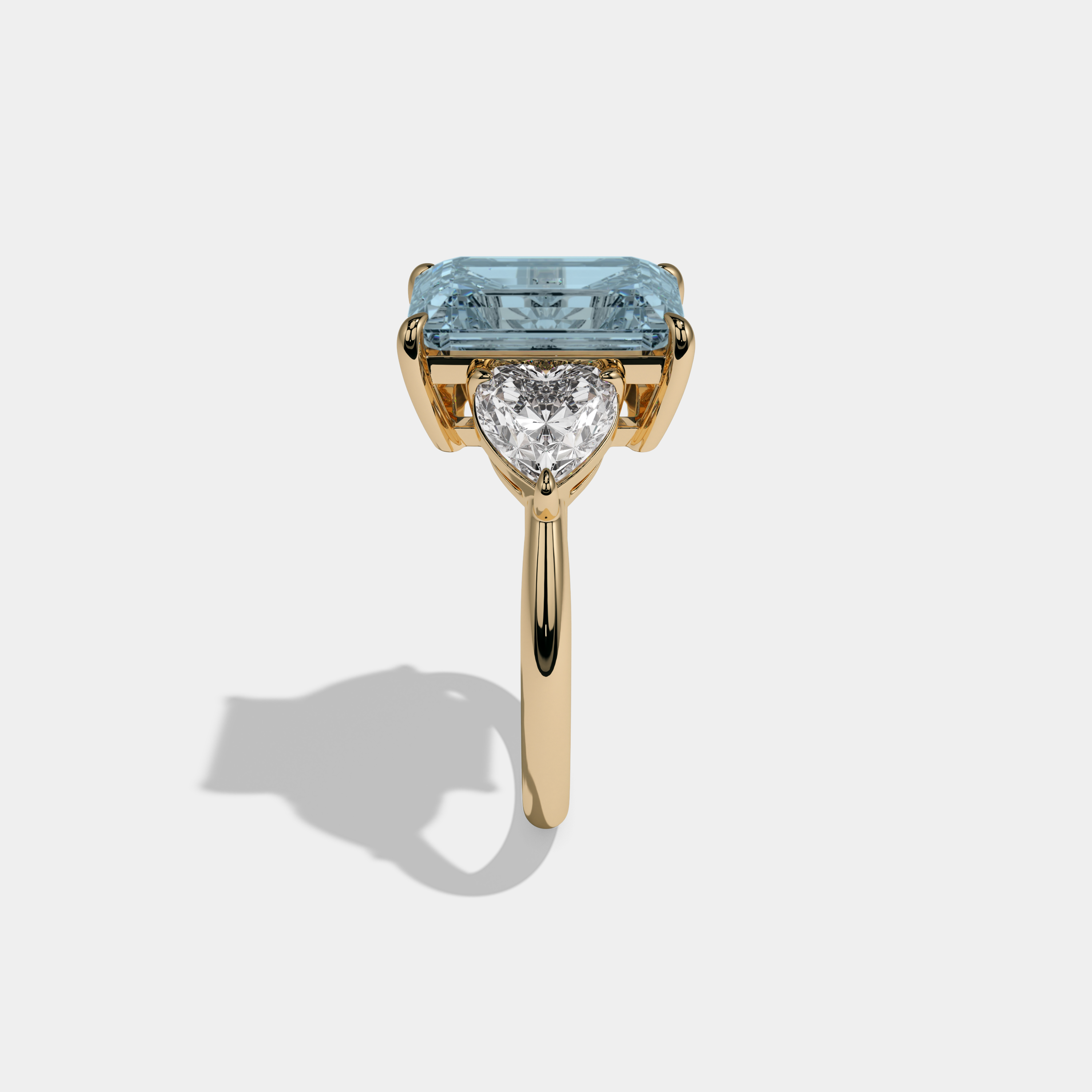 Caroline Fancy Light Blue Emerald Cut Diamond Plain Band With Heart Cut Sides Engagement Ring 8ct 18K Yellow Gold
