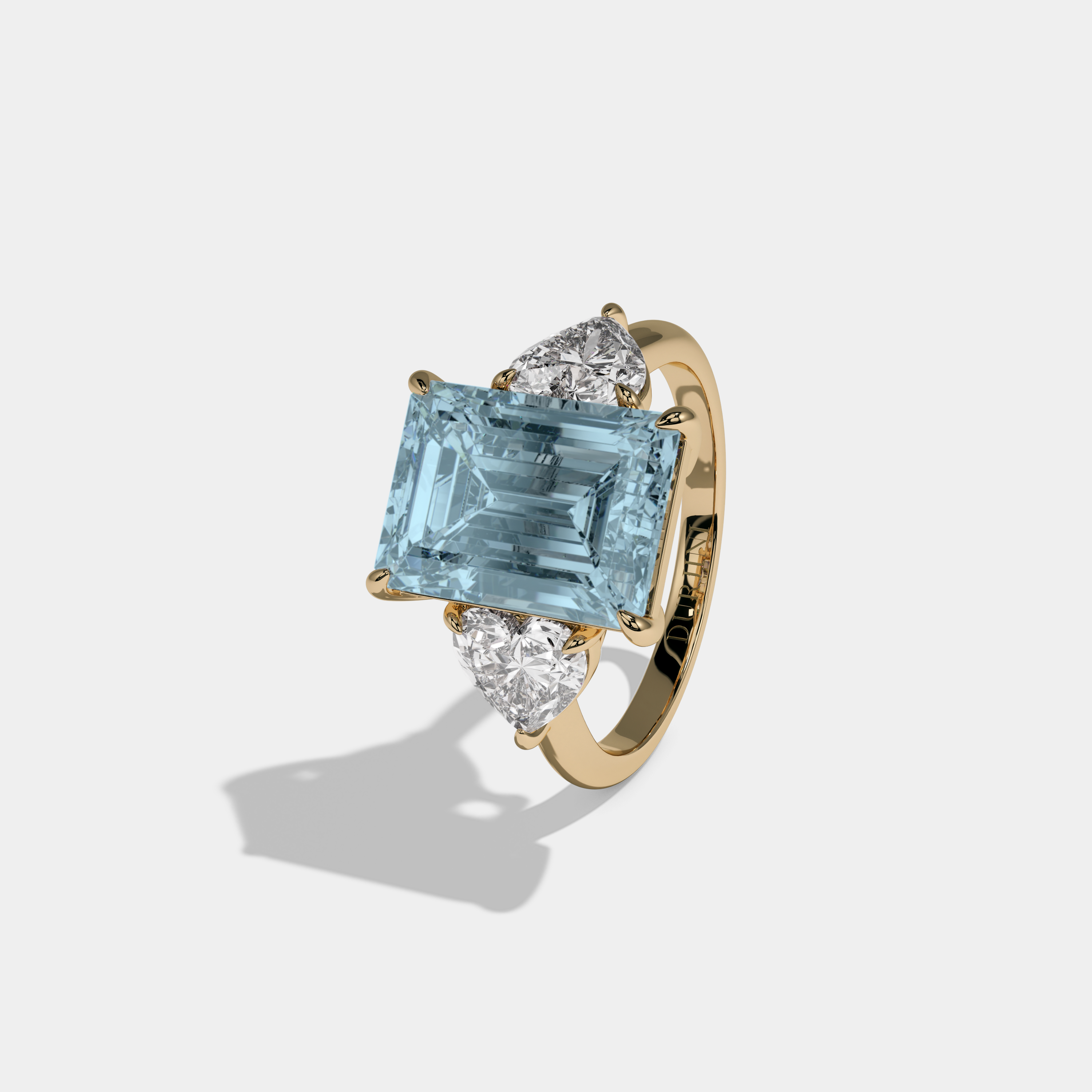 Caroline Fancy Light Blue Emerald Cut Diamond Plain Band With Heart Cut Sides Engagement Ring 8ct 18K Yellow Gold