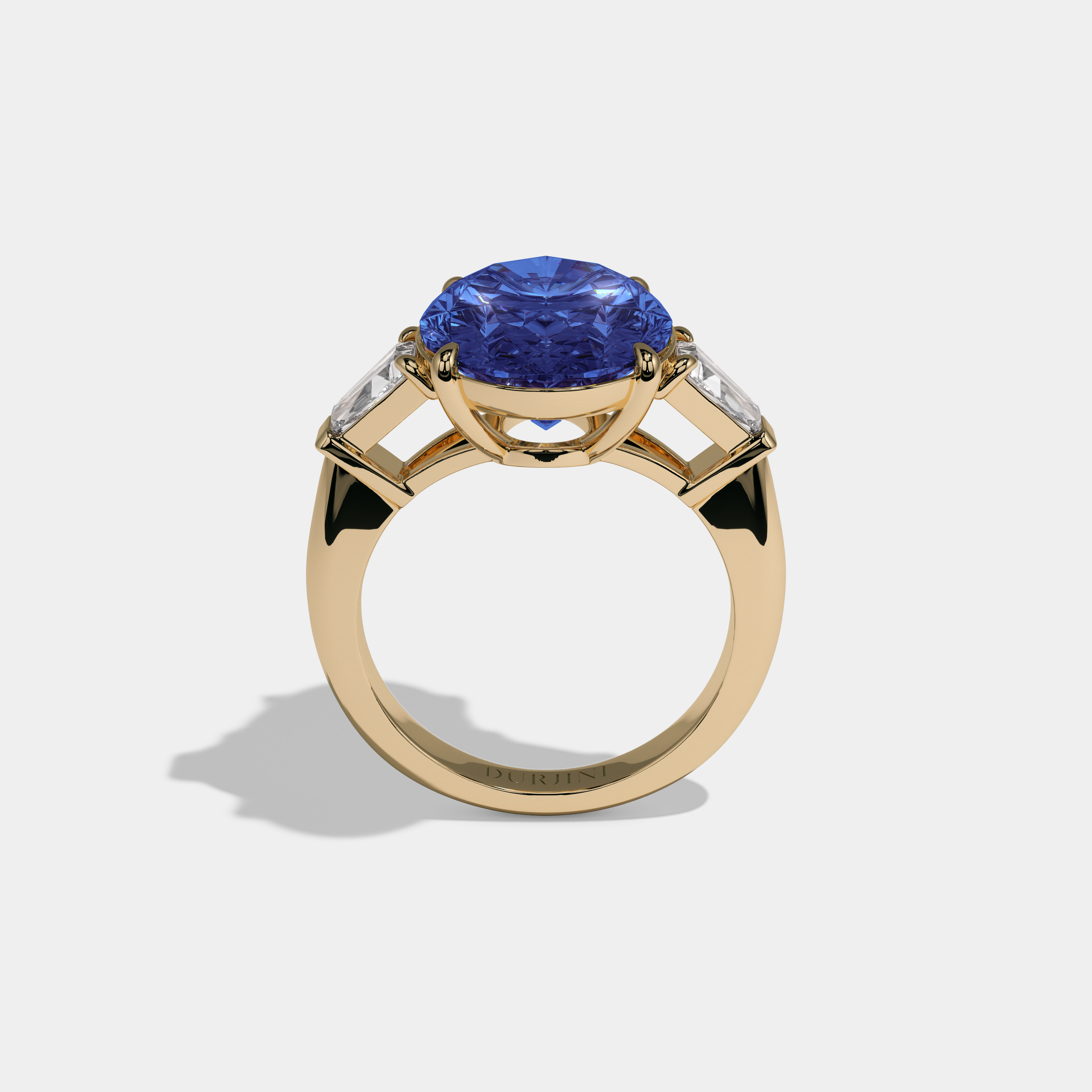 Caroline Fancy Dark Blue Oval Cut Diamond Plain Band With Tapered Baguette Cut Sides Engagement Ring 8ct 18K Yellow Gold
