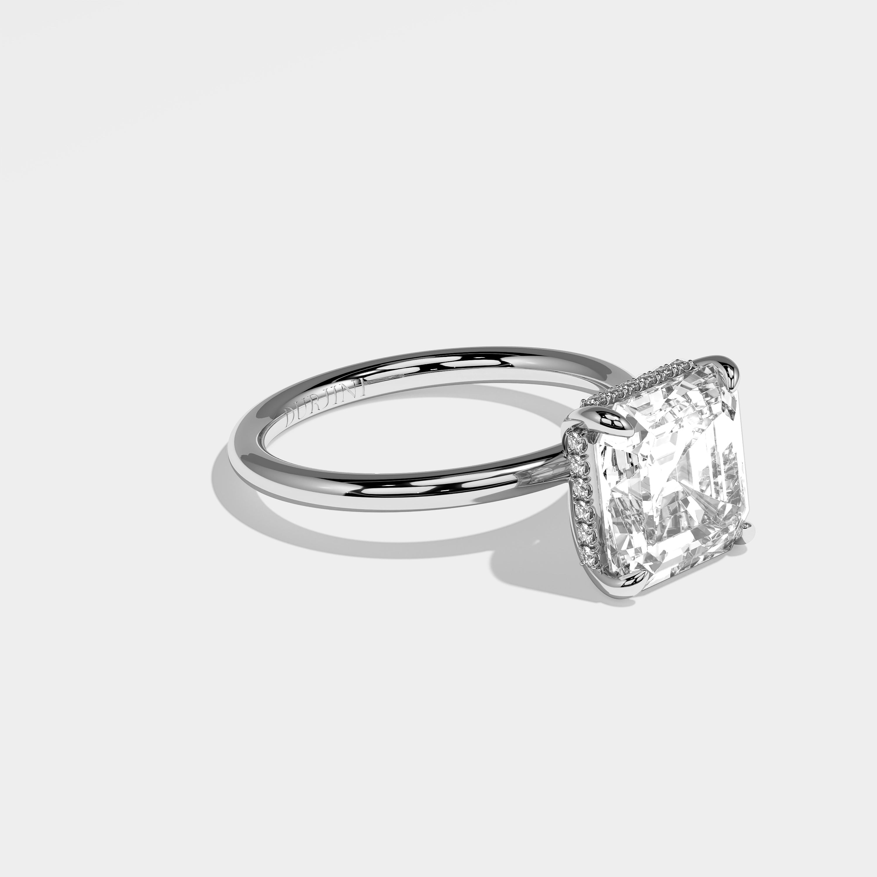 Leo Asscher-cut halo diamond engagement ring in 18K white gold by Kurbãni Durjini, right side view