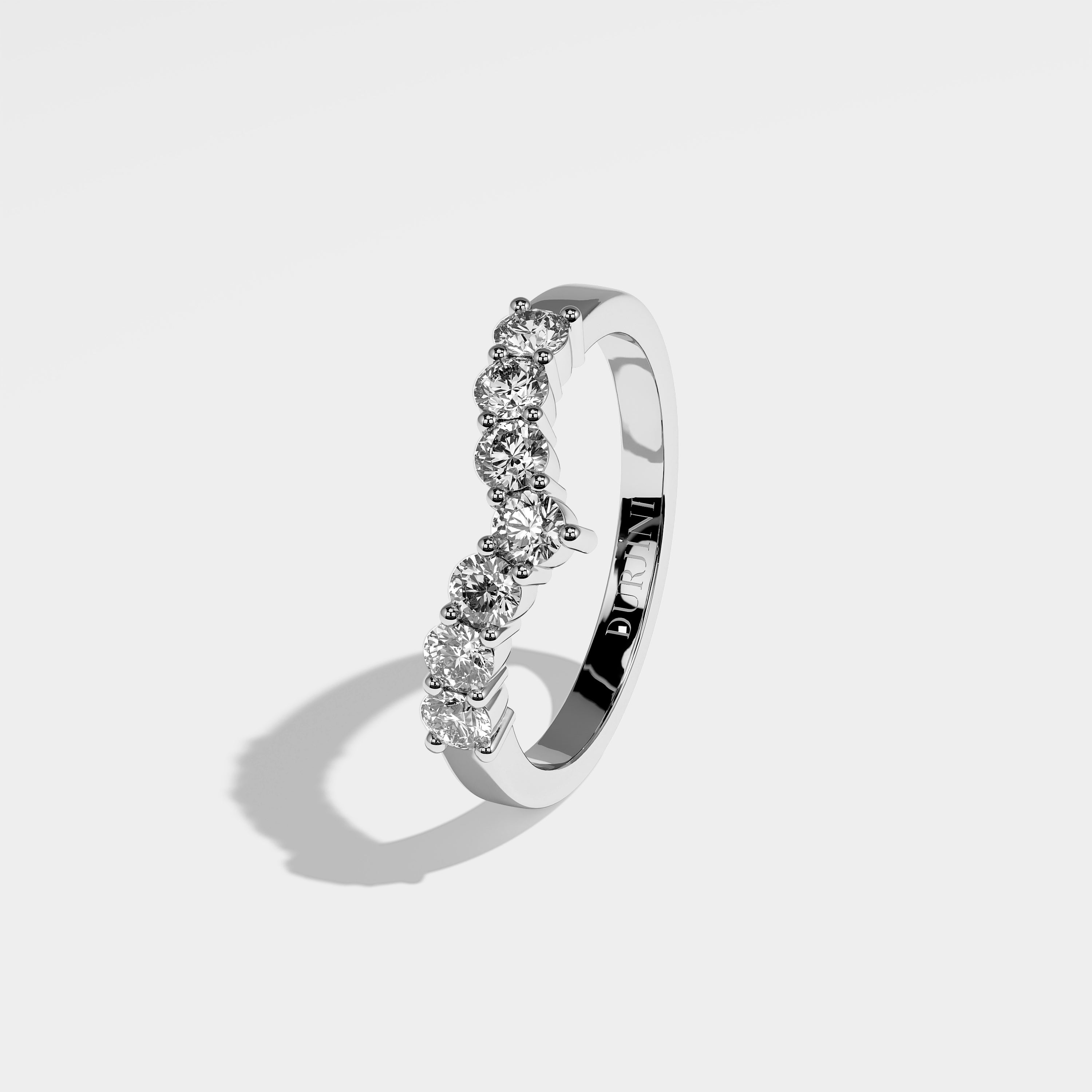 Mimi round brilliant-cut diamond engagement ring in 18K white gold by Kurbãni Durjini, left side view