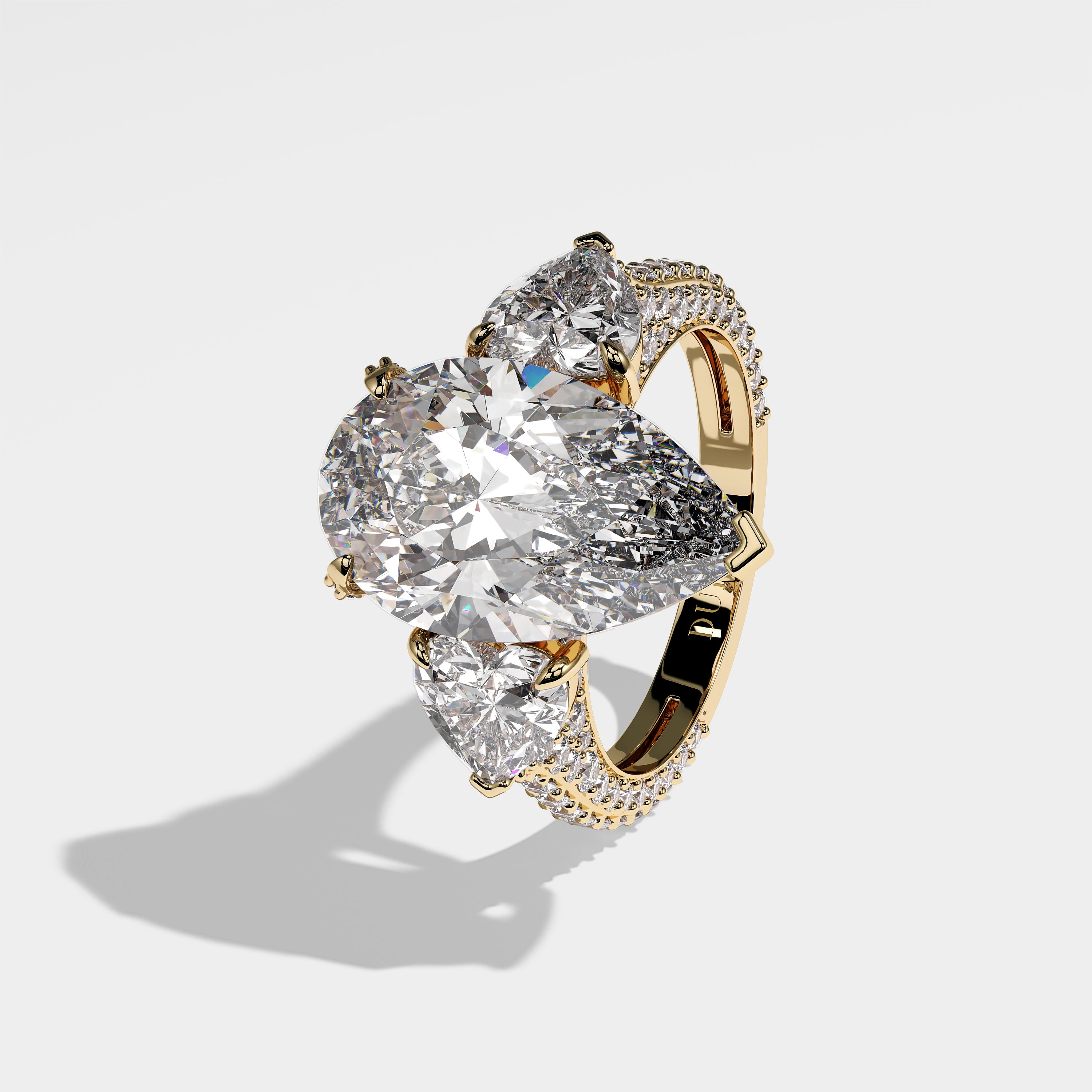 Georgia pear-cut diamond engagement ring in 18K yellow gold by Kurbãni Durjini, left side view