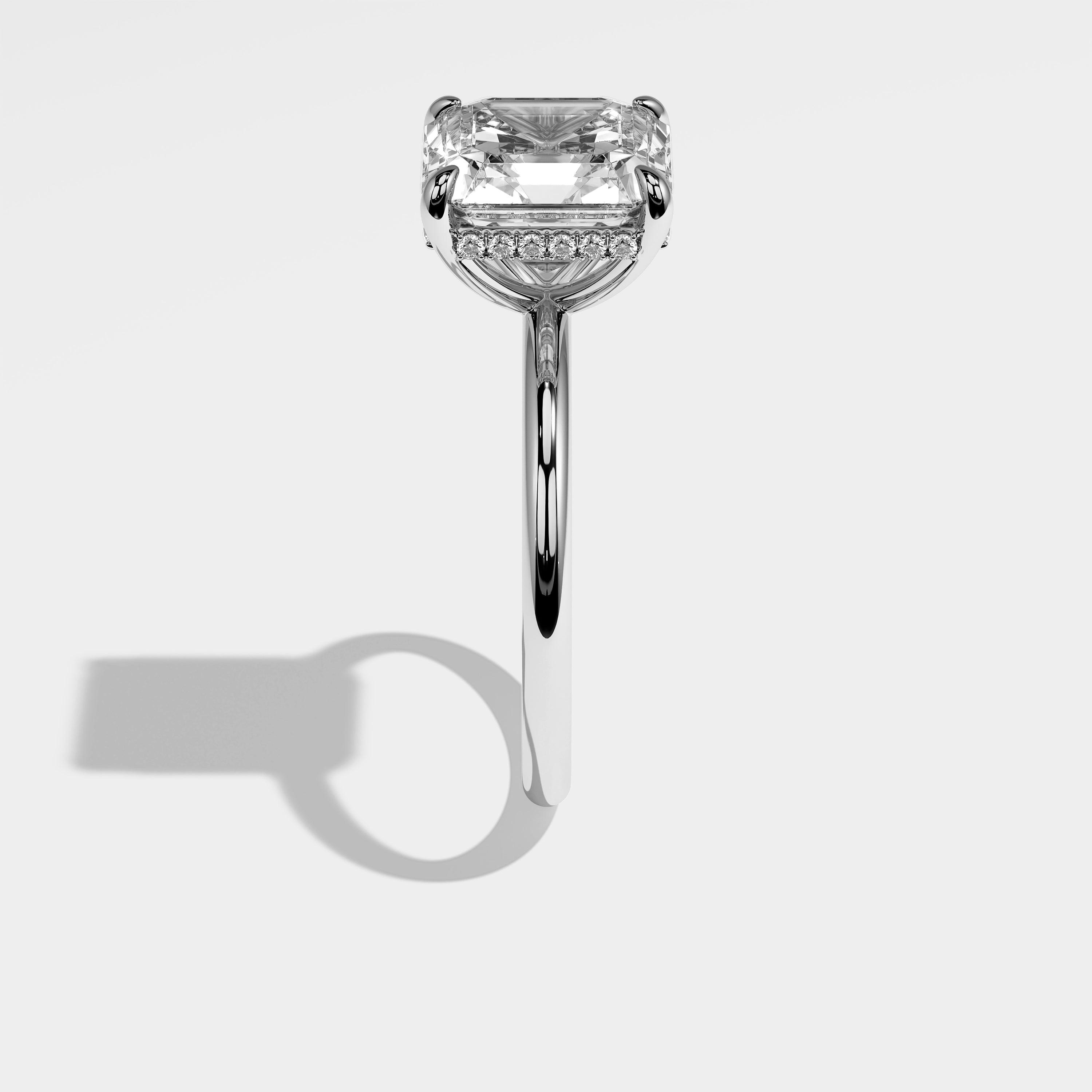 Leo Asscher-cut halo diamond engagement ring in 18K white gold by Kurbãni Durjini, side view