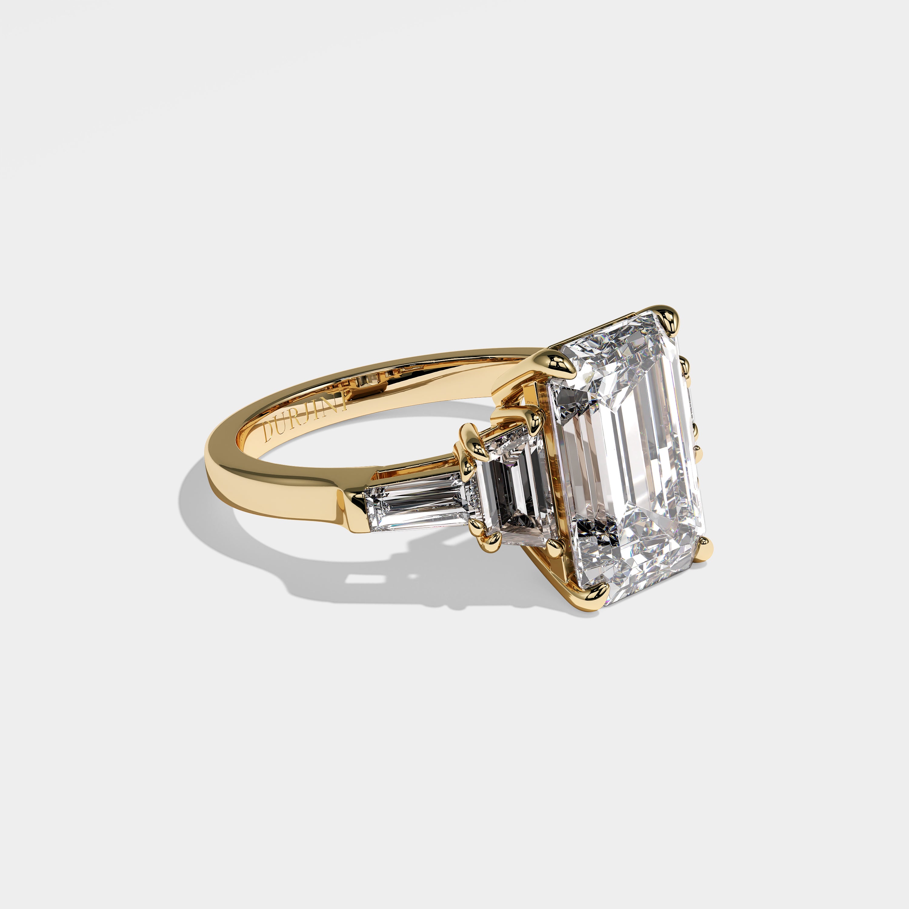 Isabella emerald-cut diamond engagement ring in 18K yellow gold by Kurbani Durjini, right side view