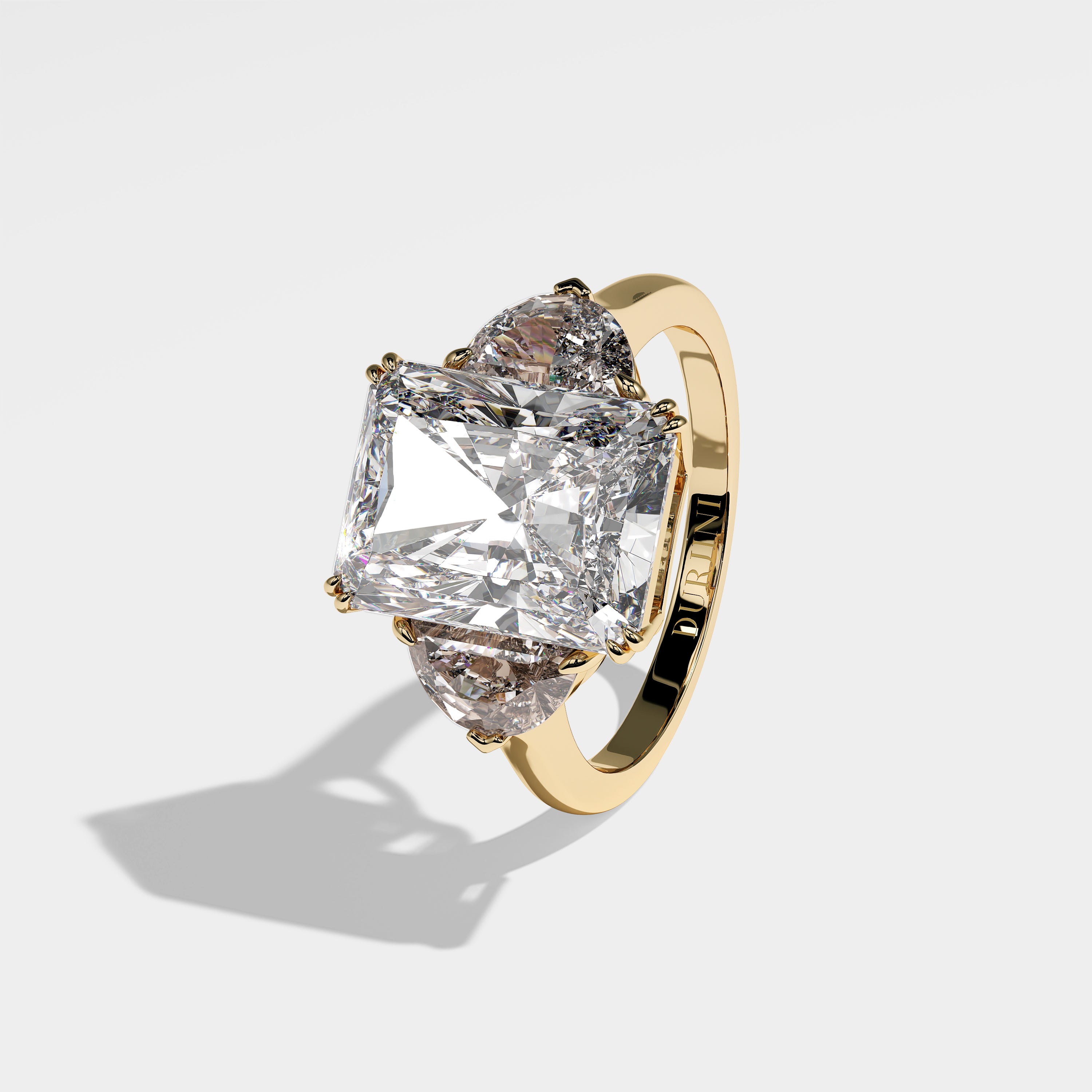 Abigail radiant-cut diamond engagement ring in 18K yellow gold by Kurbãni Durjini, left side