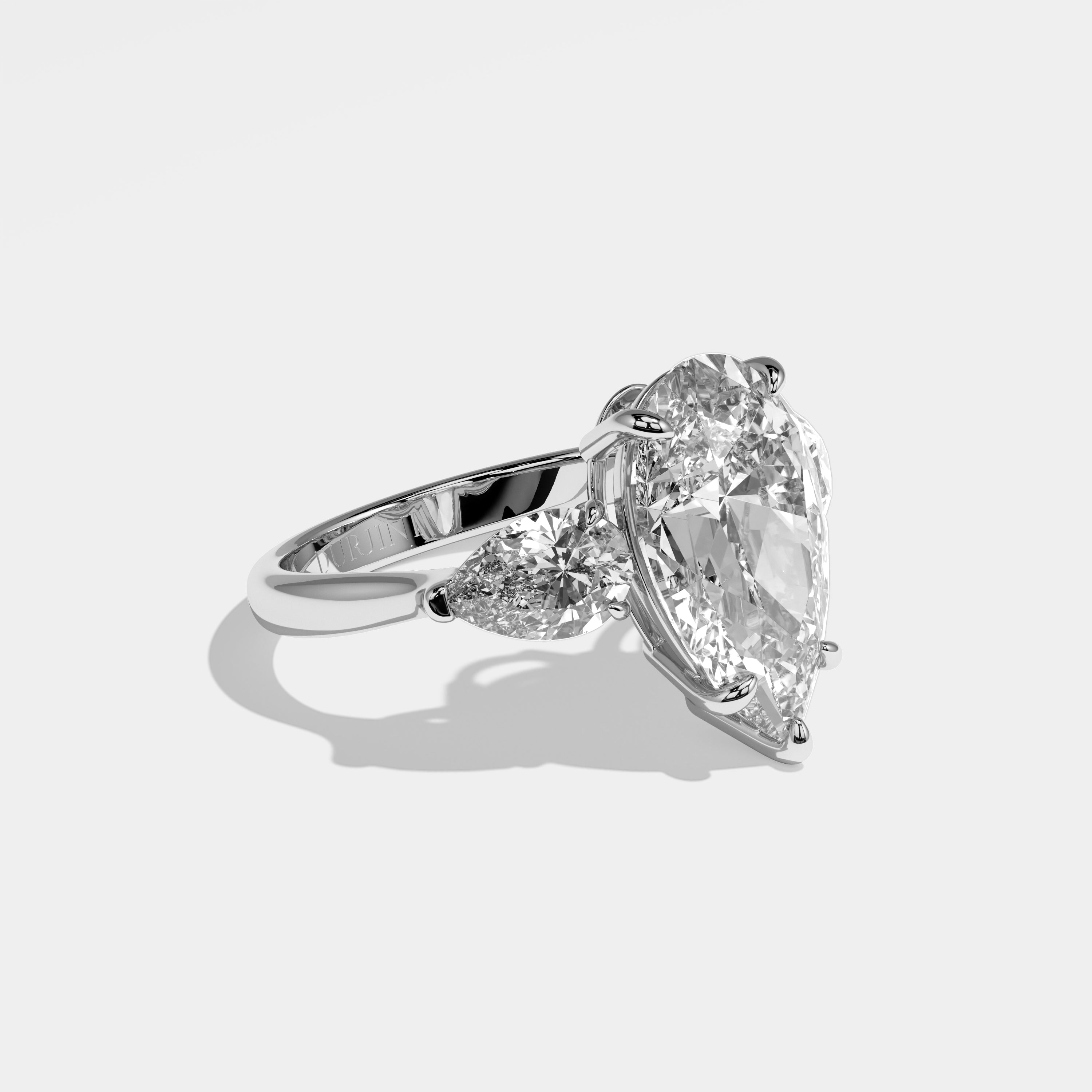 Erin pear-cut diamond engagement ring in 18K white gold by Kurbãni Durjini, right side view