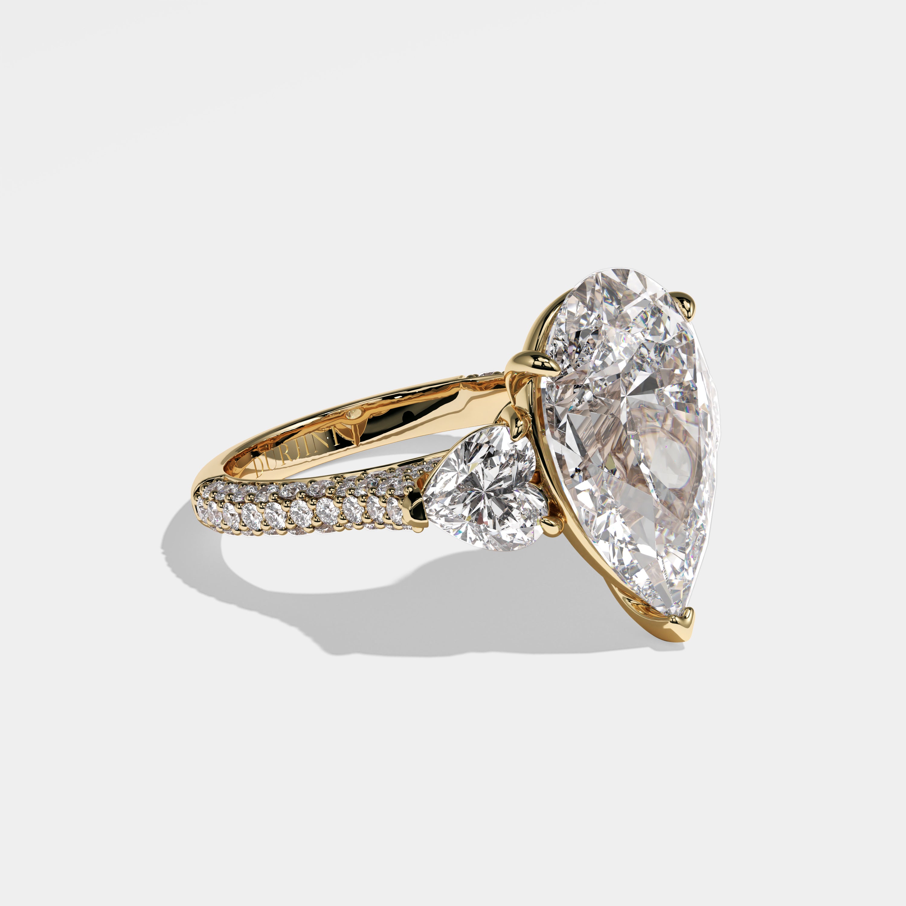 Sara pear-cut diamond engagement ring in 18K yellow gold by Kurbãni Durjini, right side view