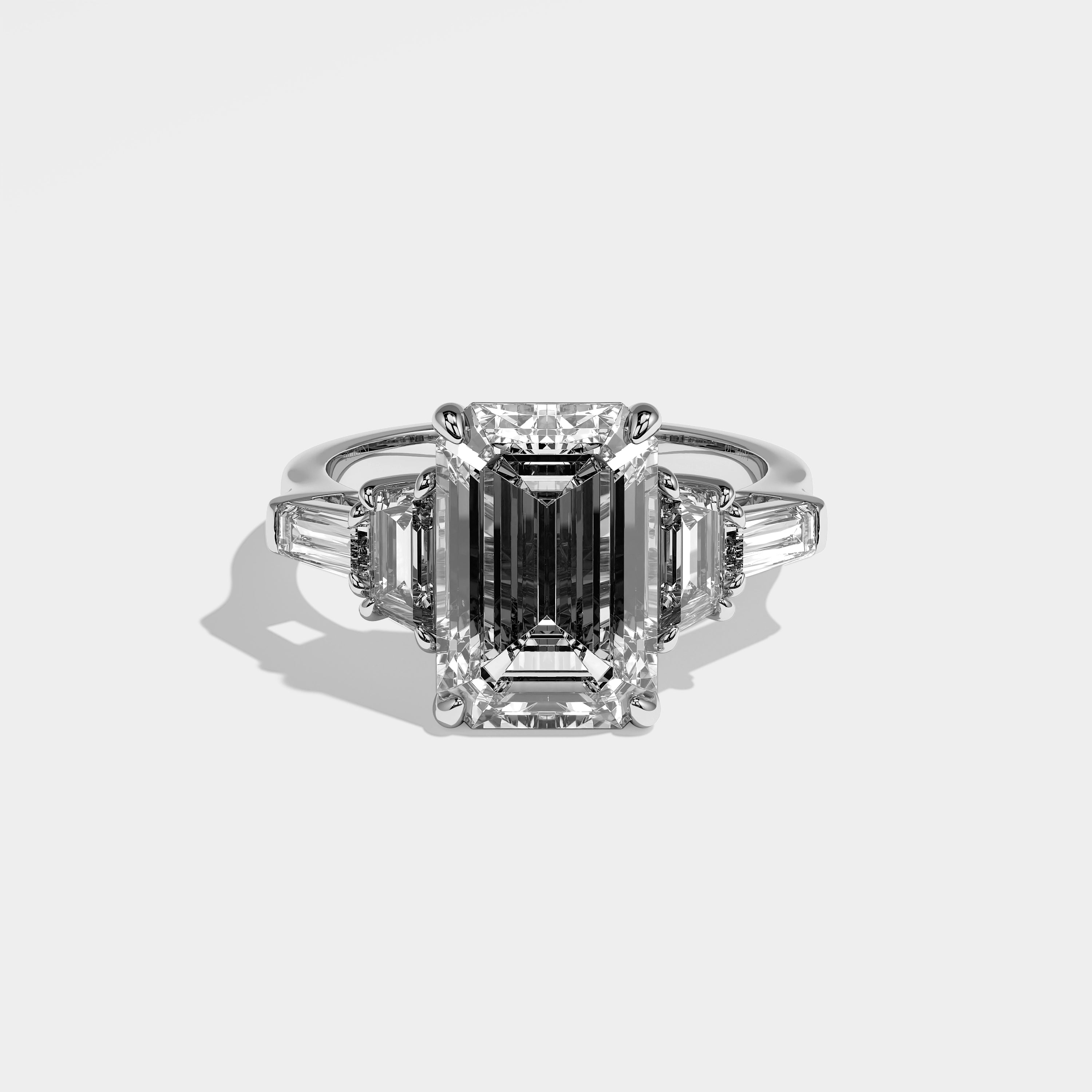 Imogen emerald-cut diamond engagement ring in 18K white gold by Kurbãni Durjini, front view