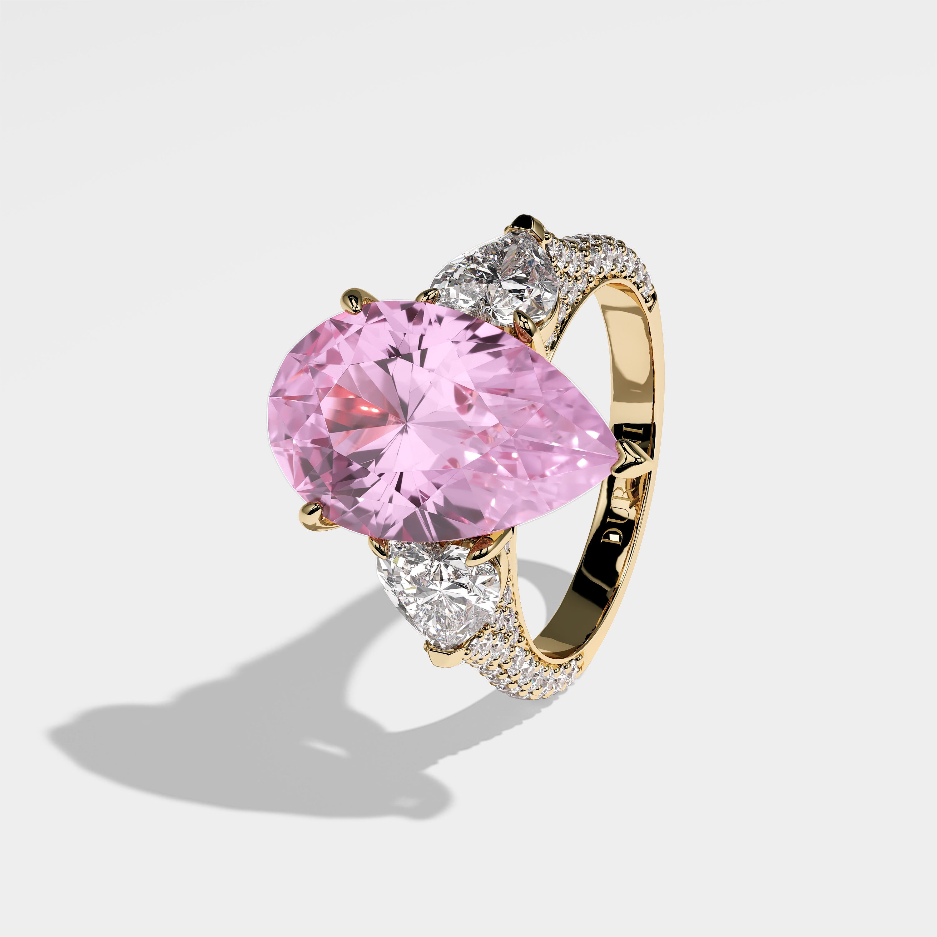 Sabah pink pear-cut diamond engagement ring in 18K yellow gold by Kurbãni Durjini, left side view