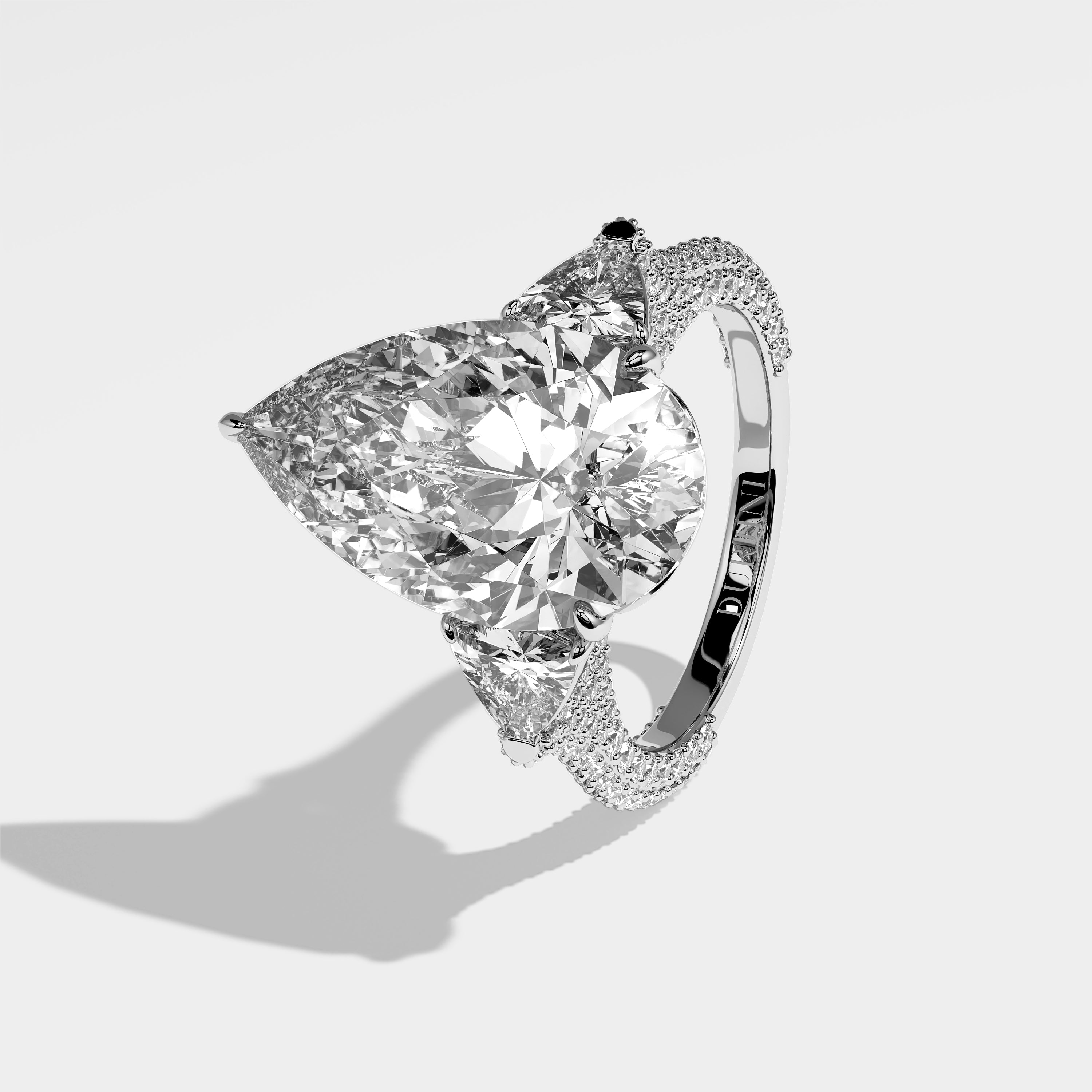 Knightsbridge pear-cut diamond engagement ring in 18K white gold by Kurbãni Durjini, left side view