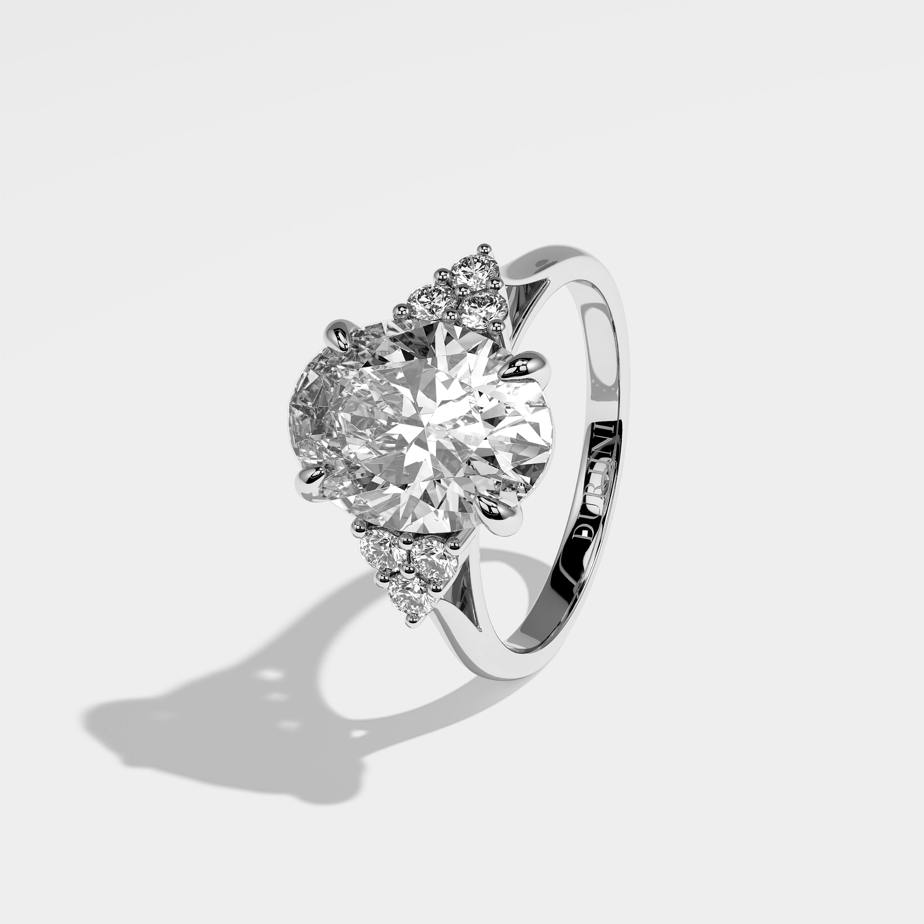 Winslow oval-cut diamond engagement ring in 18K white gold by Kurbãni Durjini, left side view