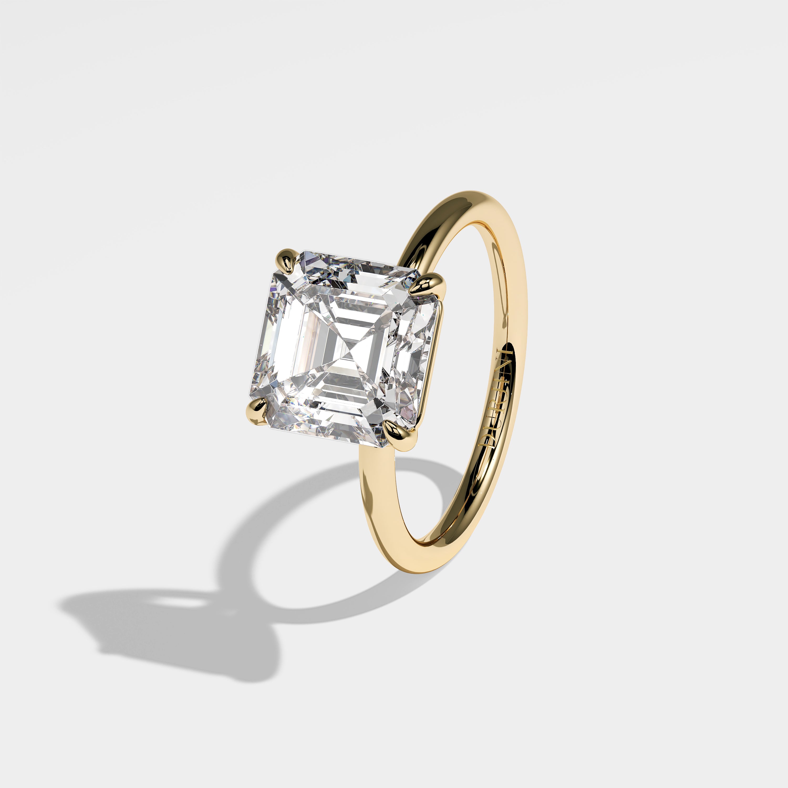 Ivy Asscher-cut diamond engagement ring in 18K yellow gold by Kurbãni Durjini, left side view