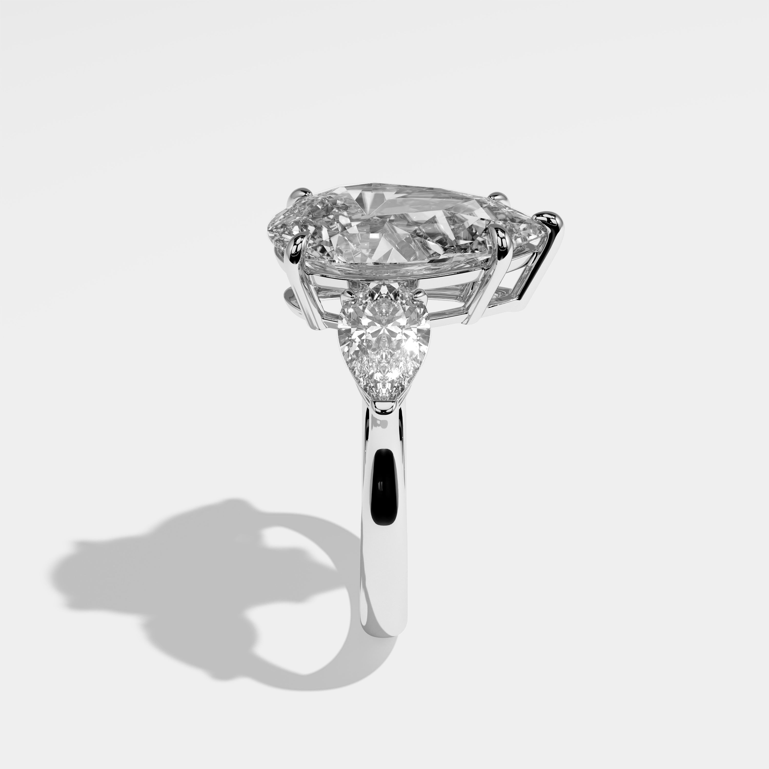 Erin pear-cut diamond engagement ring in 18K white gold by Kurbãni Durjini, side view