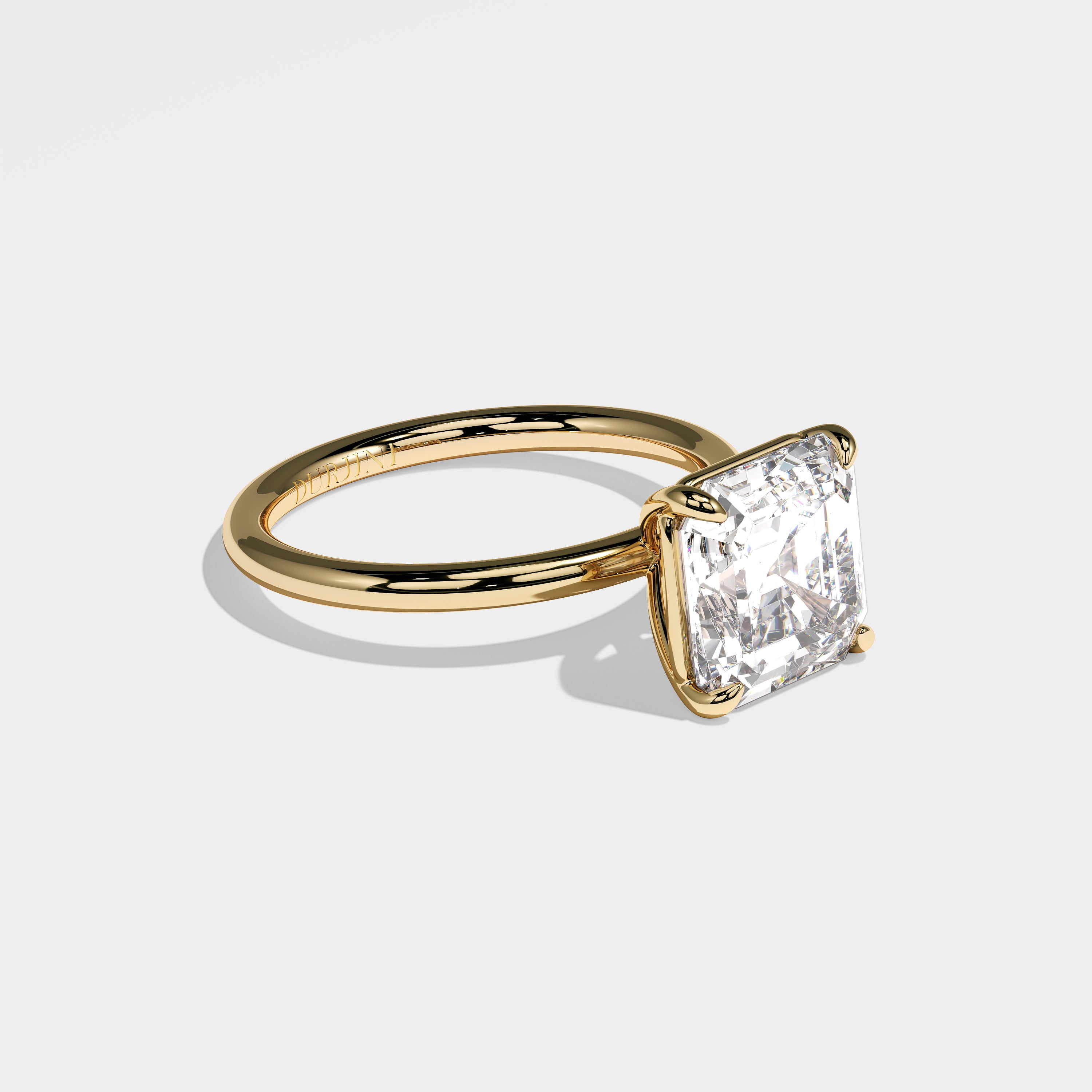 Ivy Asscher-cut diamond engagement ring in 18K yellow gold by Kurbãni Durjini, right side view