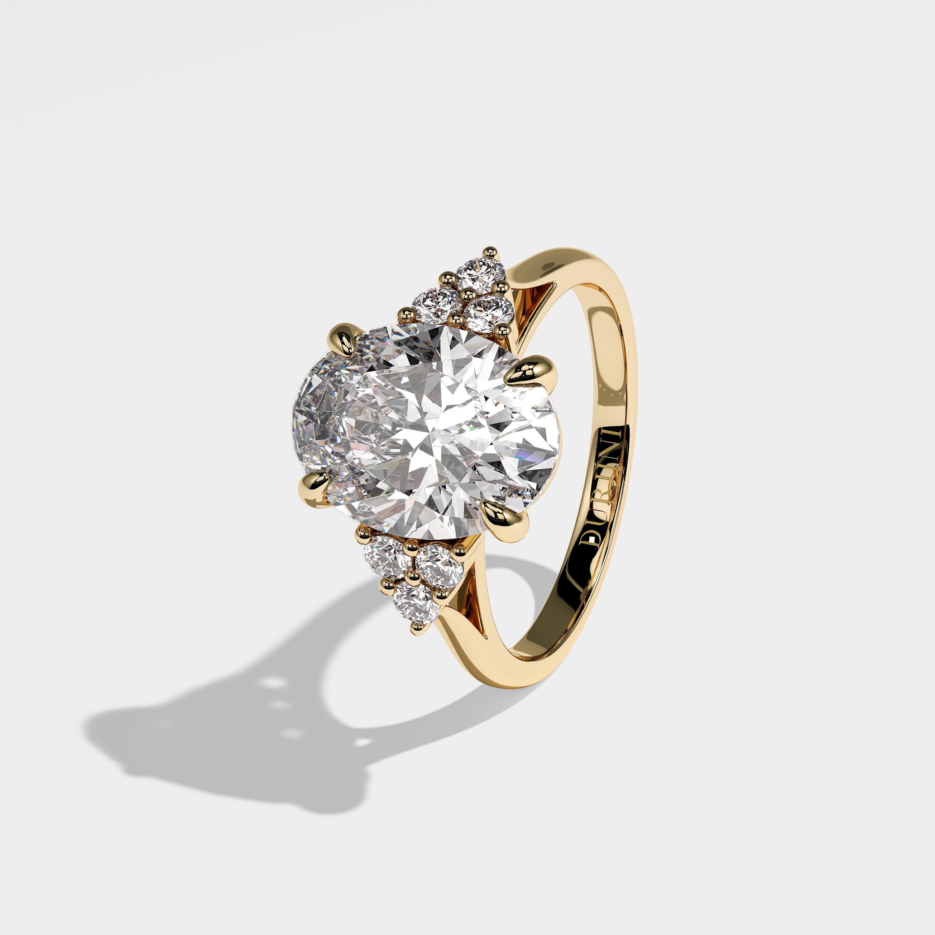 Forrest oval-cut diamond engagement ring in 18K yellow gold by Kurbãni Durjini, left side view