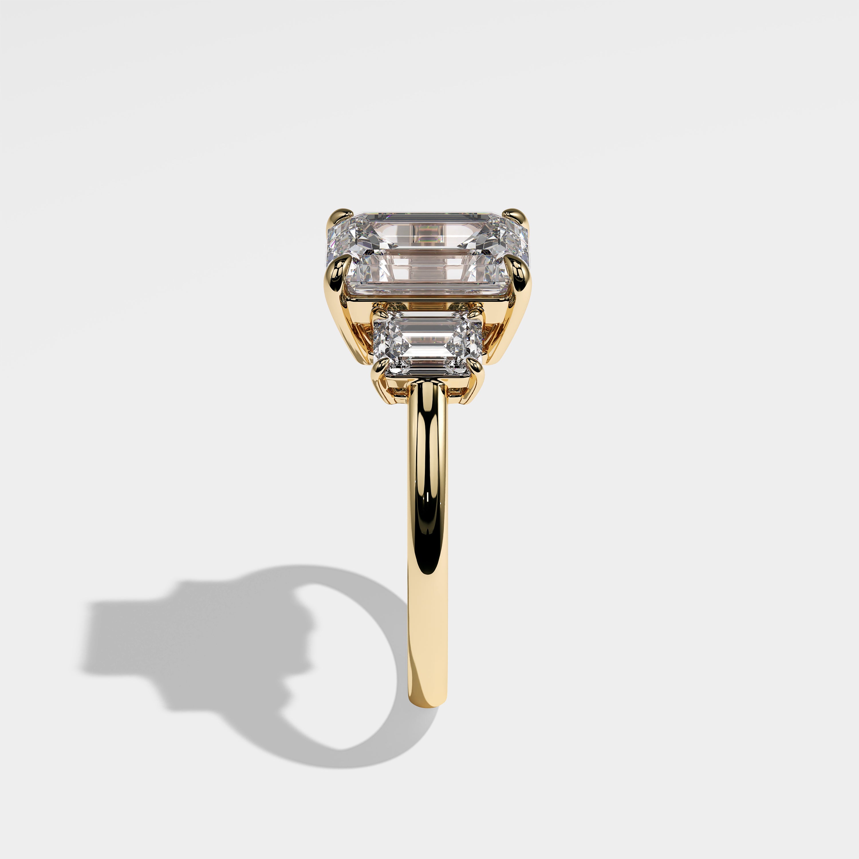 Rose emerald-cut diamond engagement ring in 18K yellow gold by Kurbãni Durjini, side view