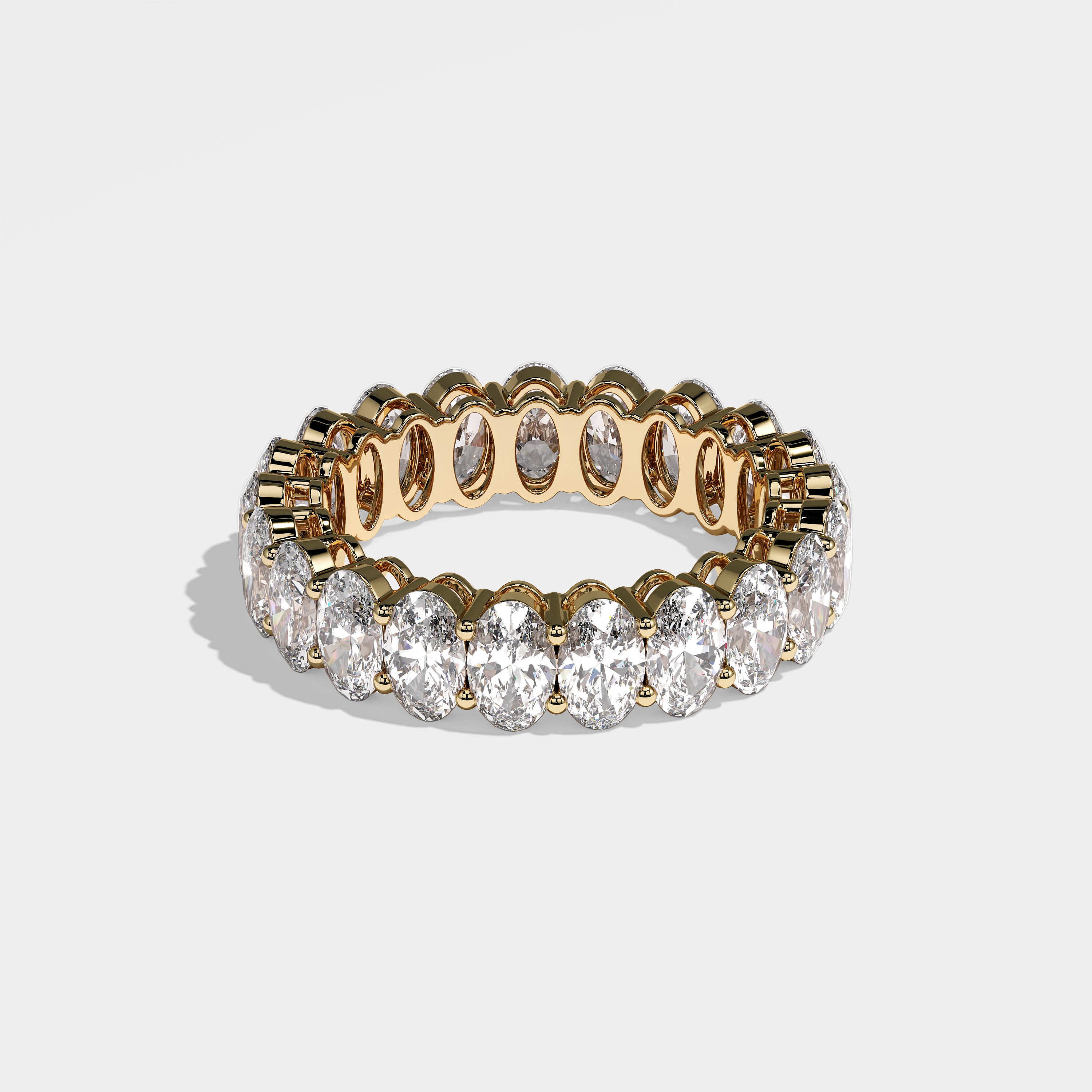 Emre oval-cut eternity diamond engagement ring in 18K yellow gold by Kurbãni Durjini, right side view