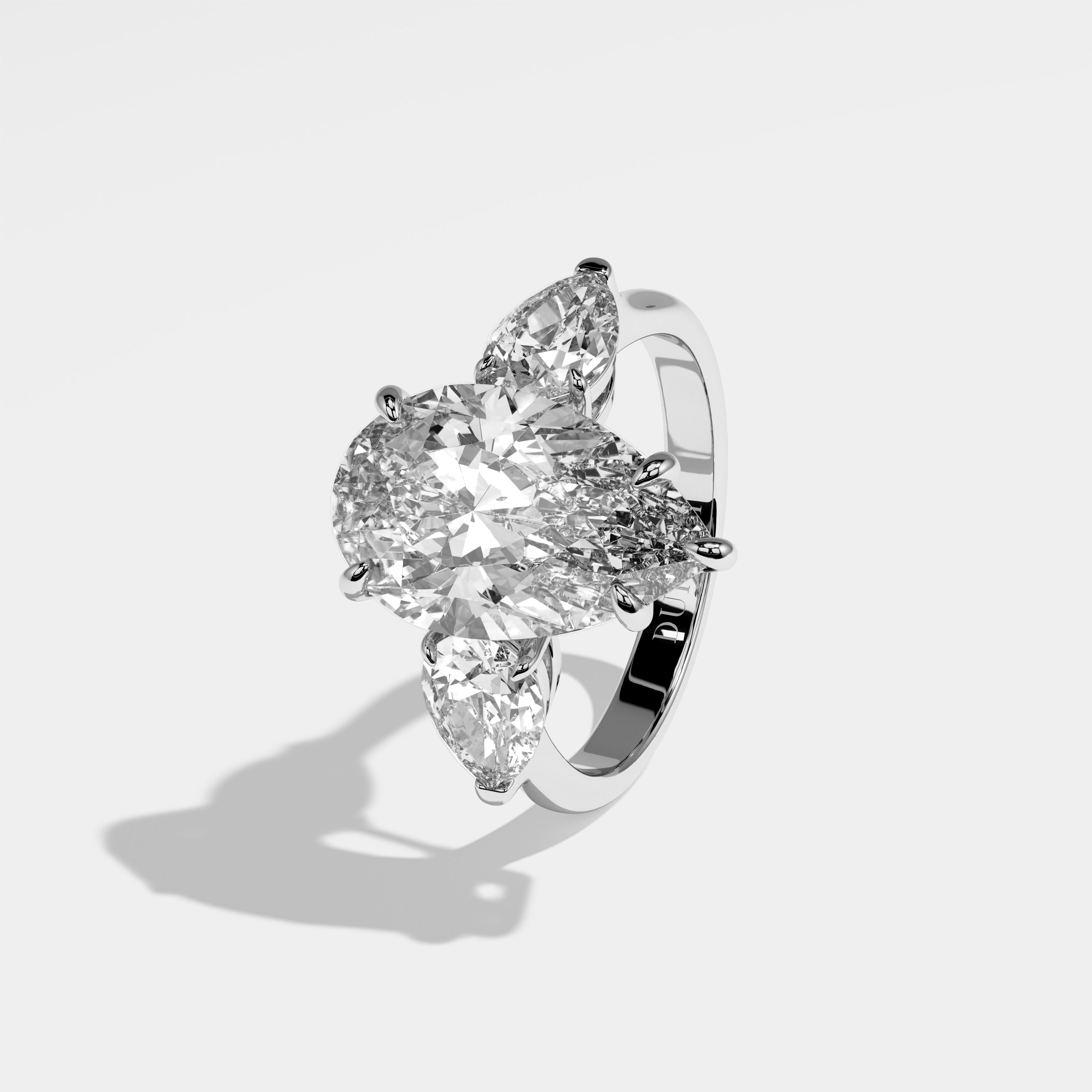 Erin pear-cut diamond engagement ring in 18K white gold by Kurbãni Durjini, left side view