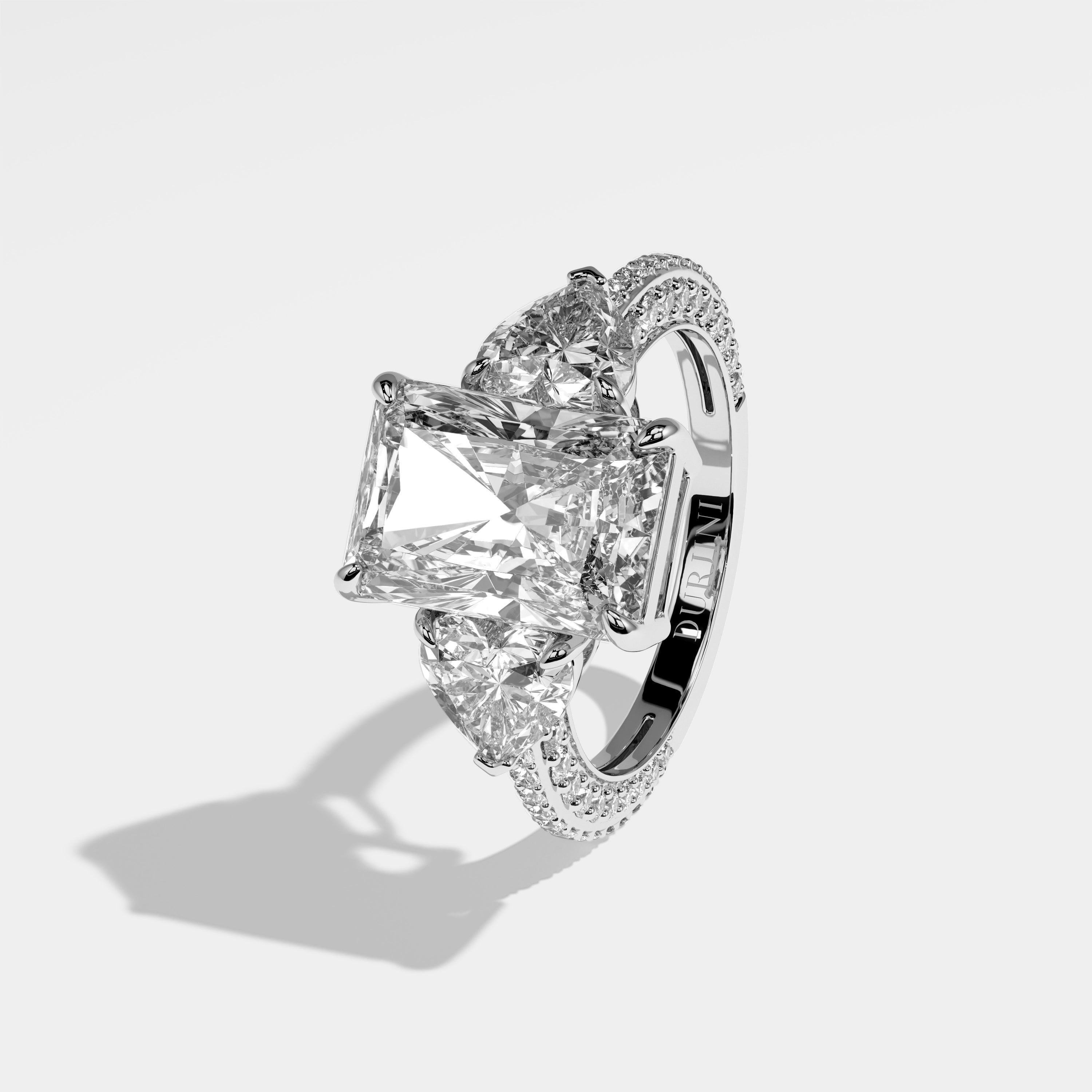 Monroe radiant-cut diamond engagement ring in 18K white gold by Kurbãni Durjini, left side view